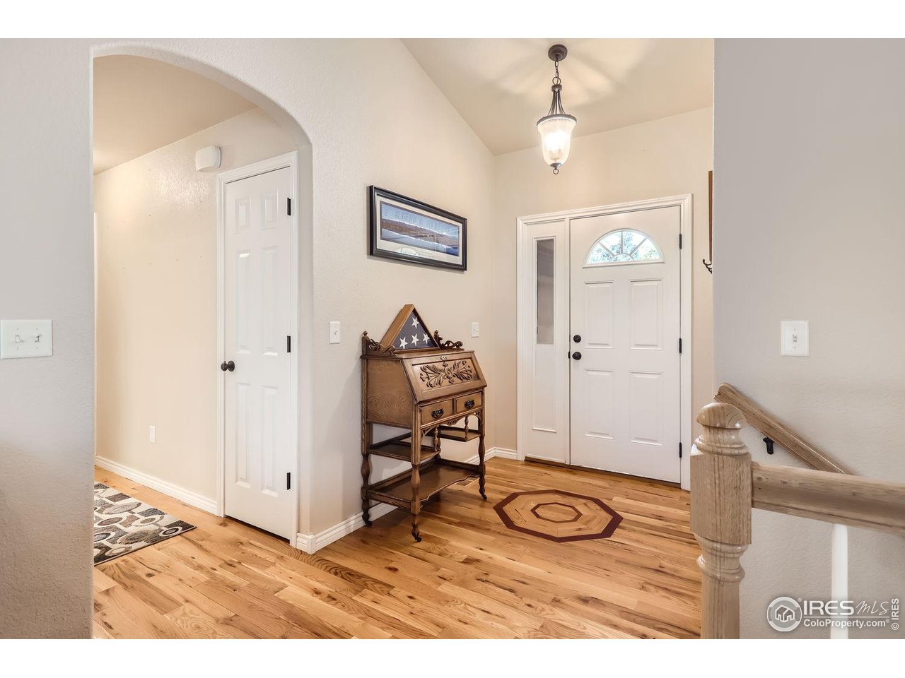 135 Falcon Circle Mead, CO 80542 - Photo 4 of 27 a view of a livingroom with furniture and wooden floor