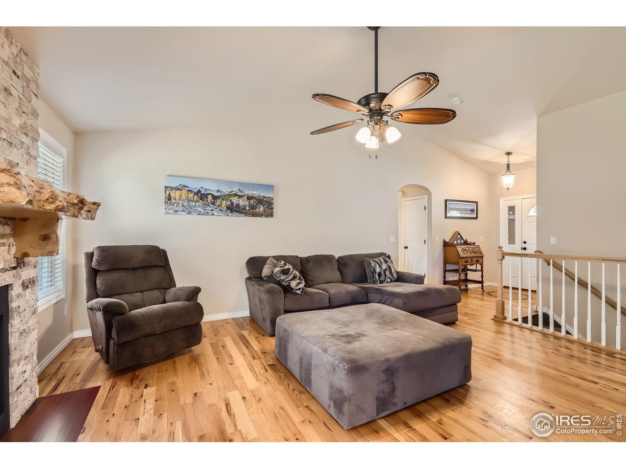 135 Falcon Circle Mead, CO 80542 - Photo 8 of 27 a living room with furniture and a wooden floor