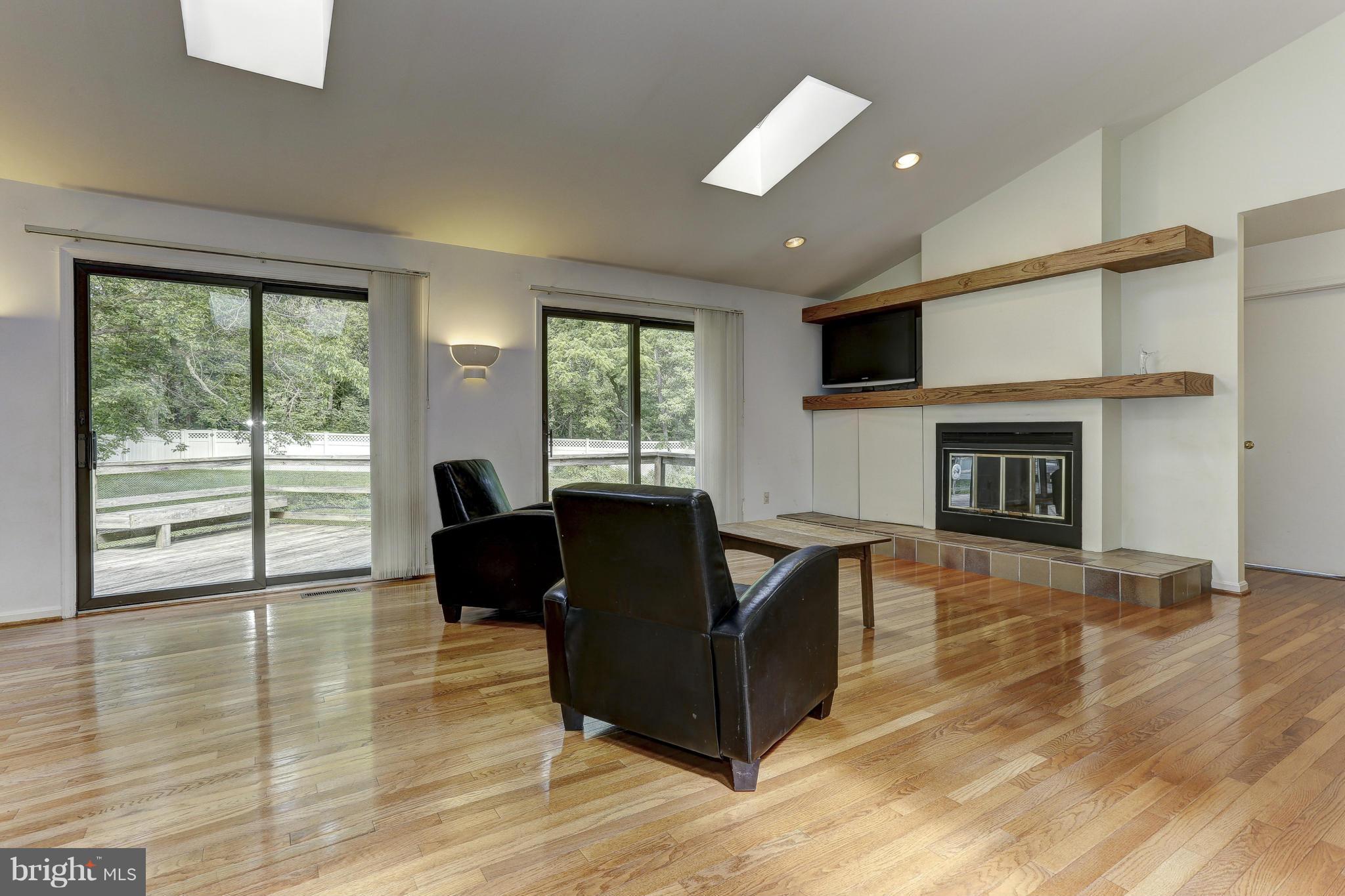 3978 View Top Road Ellicott City, MD 21042 - Photo 3 of 30 a living room with furniture and a fireplace