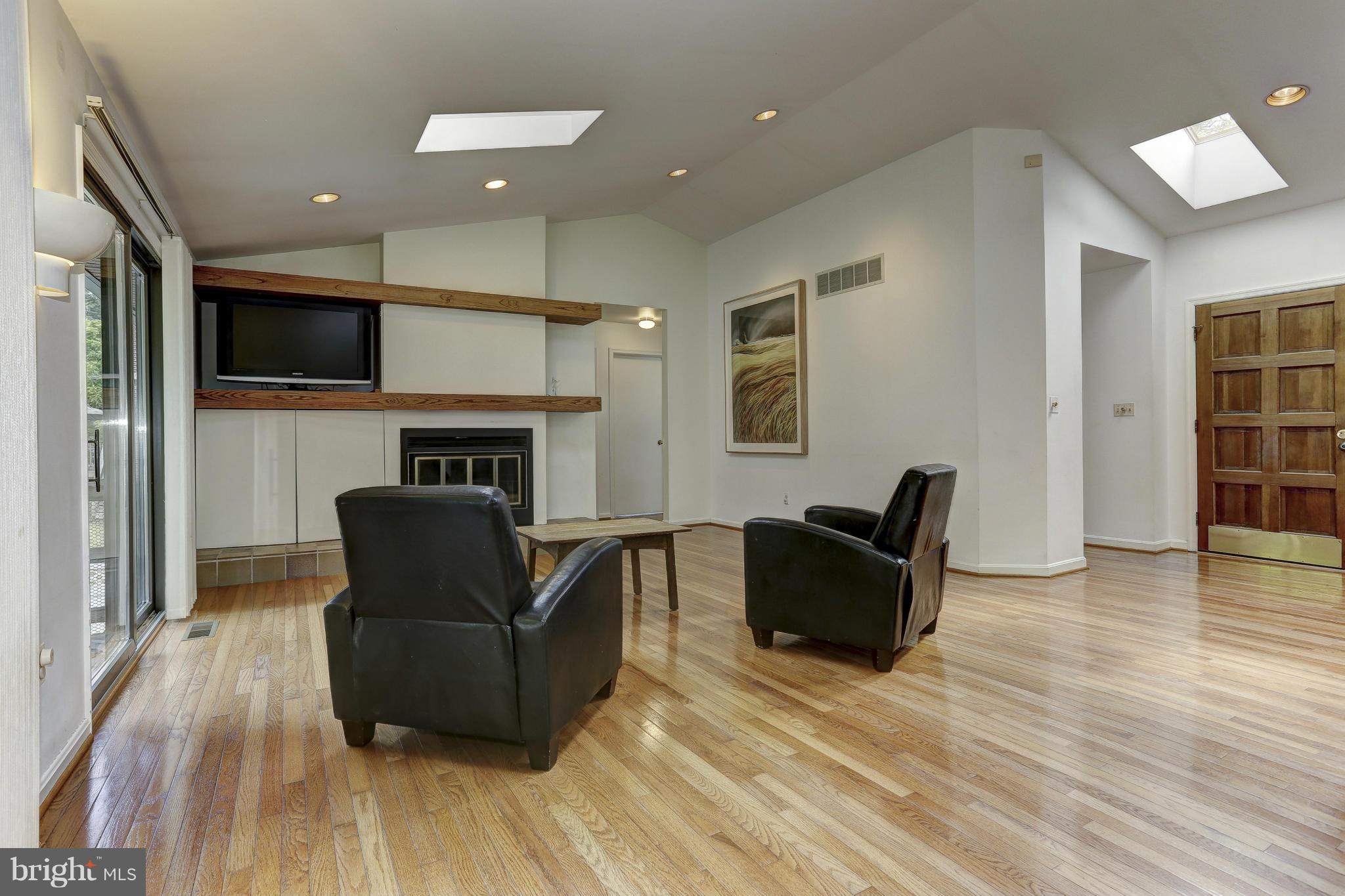 3978 View Top Road Ellicott City, MD 21042 - Photo 5 of 30 a living room with furniture and a fireplace