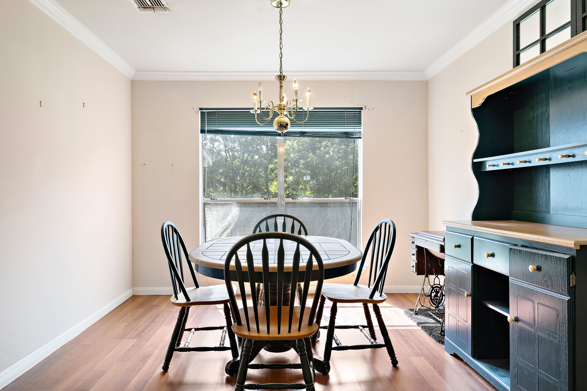 615 Runners Ridge Pflugerville, TX 78660 - Photo 9 of 32 a view of a dining room with furniture window and wooden floor