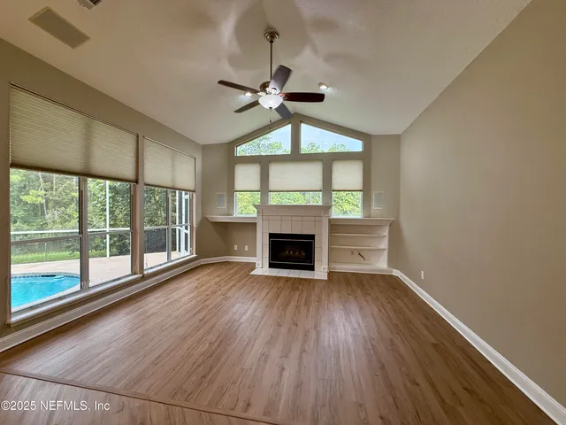 a utility room with cabinets washer and dryer