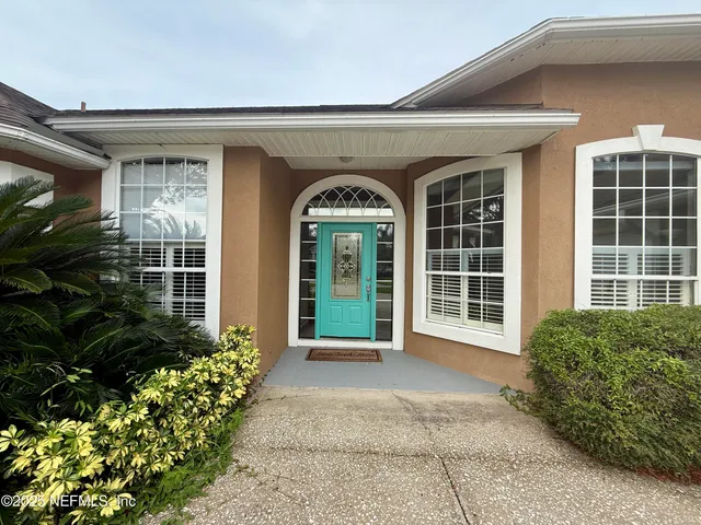 a view of a room with wooden floor and staircase