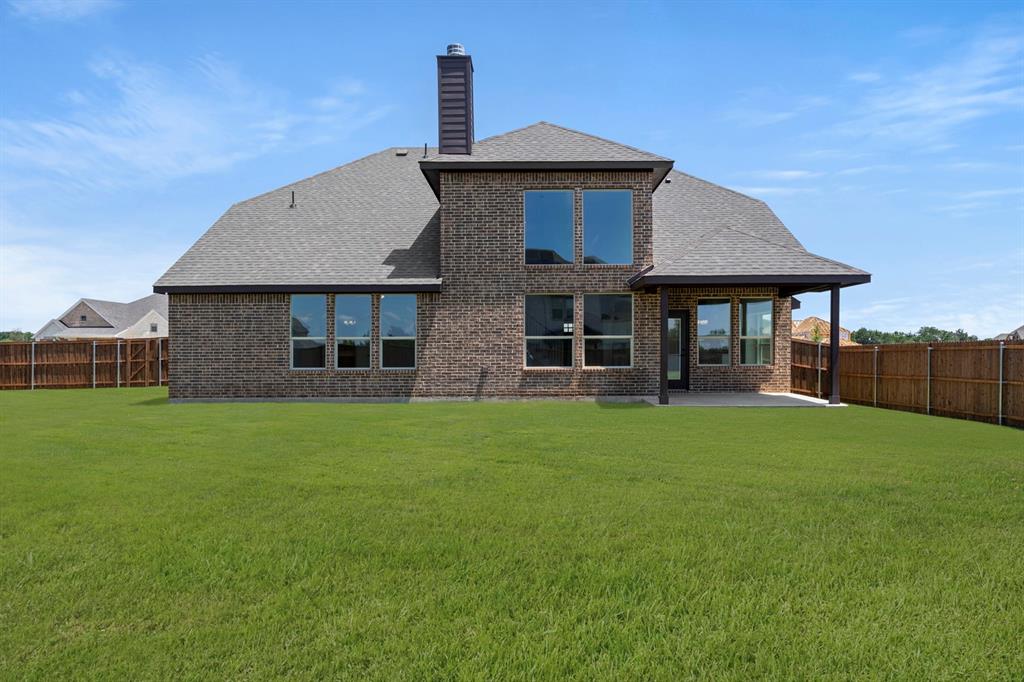 505 Alto Avenue Forney, TX 75126 - Photo 31 of 32 a front view of a house with a garden