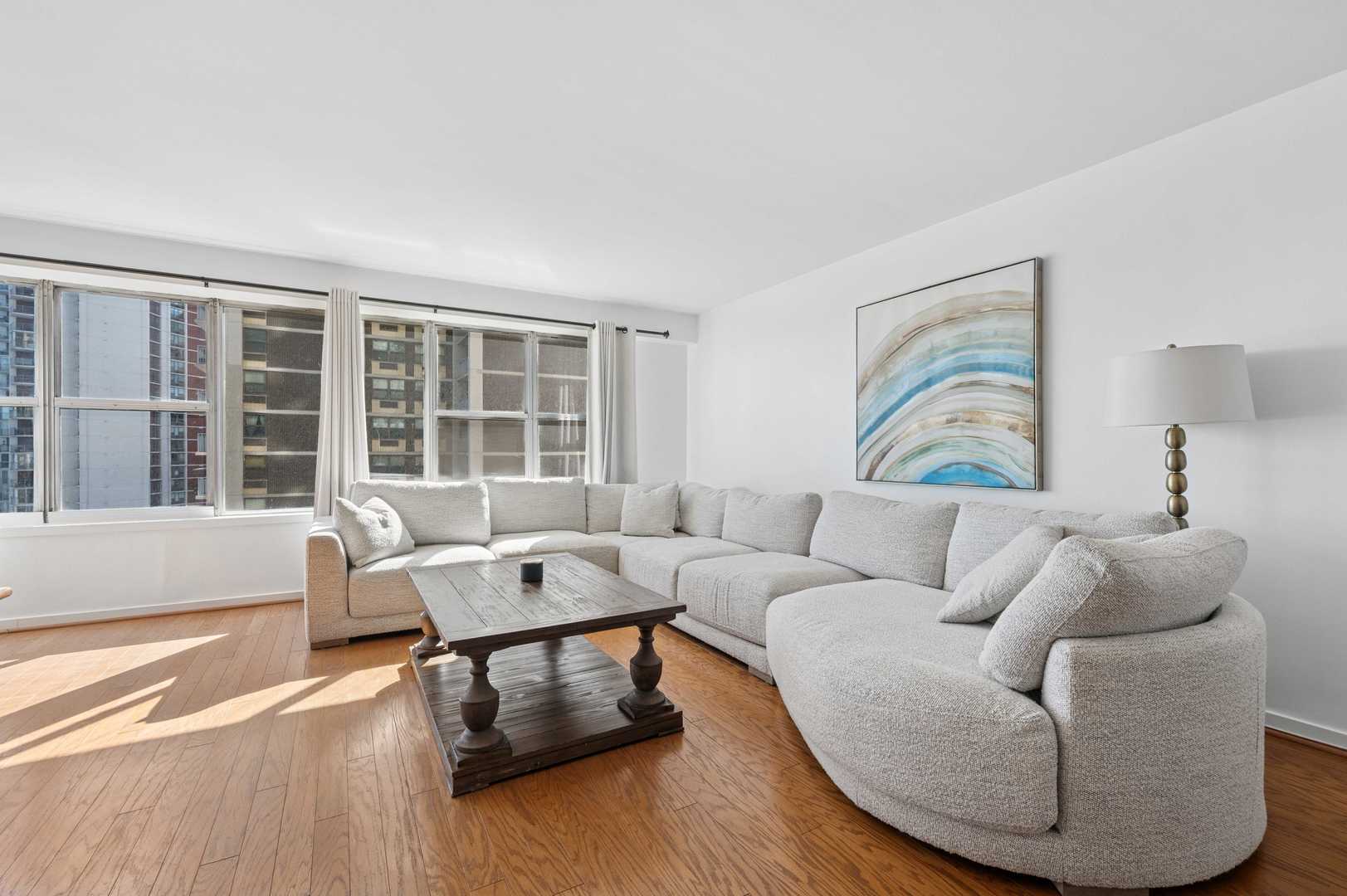 6157 North Sheridan Road, Unit 6K Chicago, IL 60660 - Photo 6 of 18 a living room with furniture and a large window