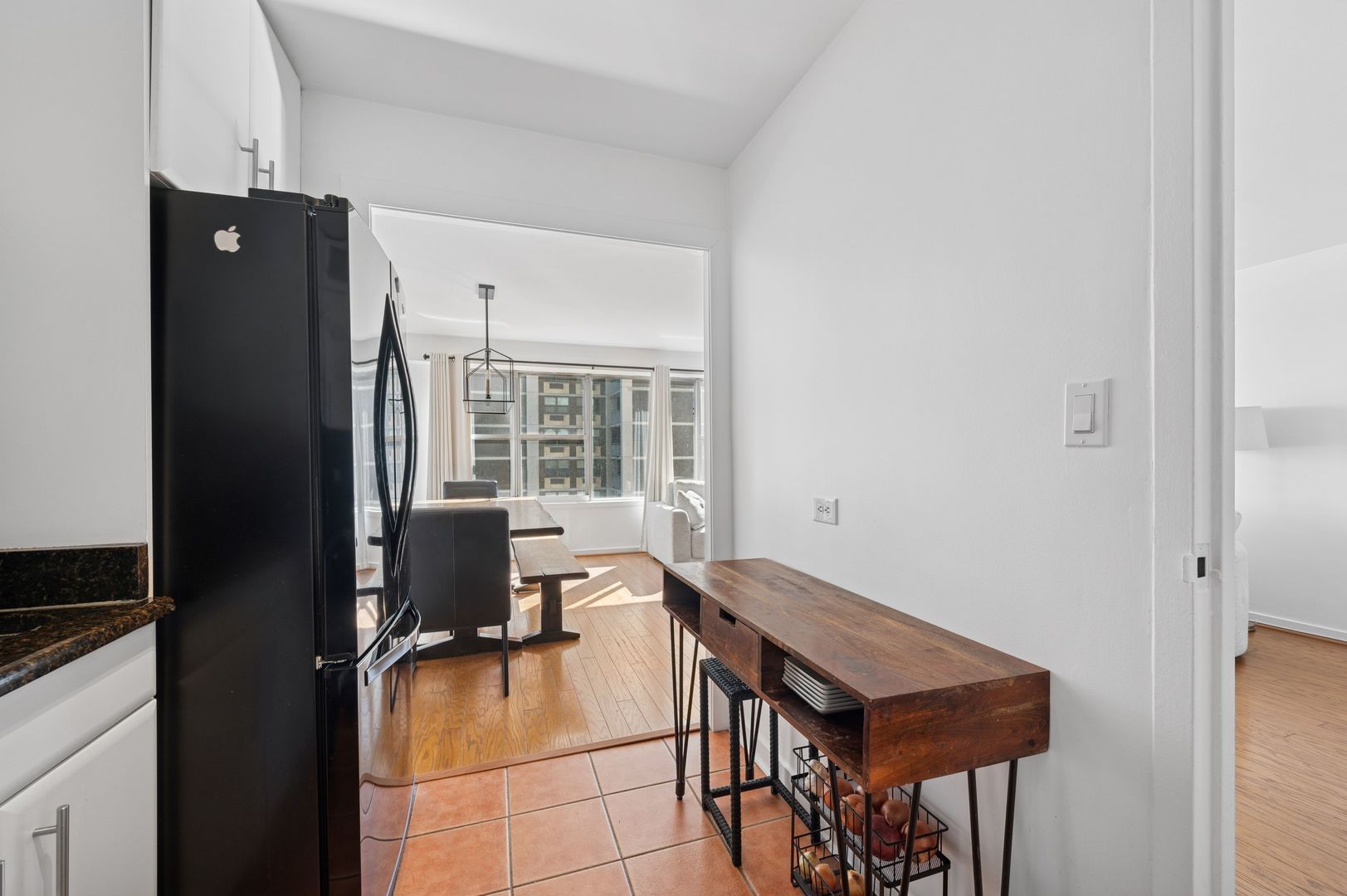6157 North Sheridan Road, Unit 6K Chicago, IL 60660 - Photo 9 of 18 a view of a workspace with furniture and a window