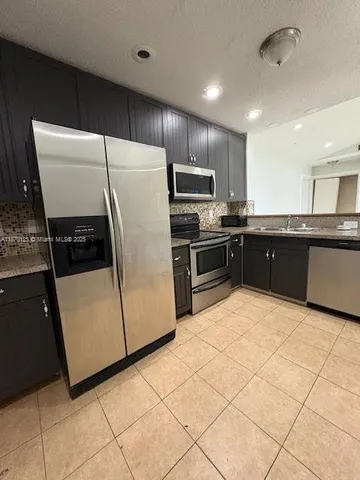 a large kitchen with cabinets