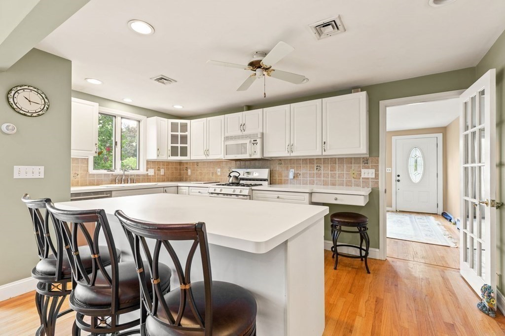 29 Marshall Road Easton, MA 02356 - Photo 15 of 31 a kitchen with a table chairs stove and cabinets