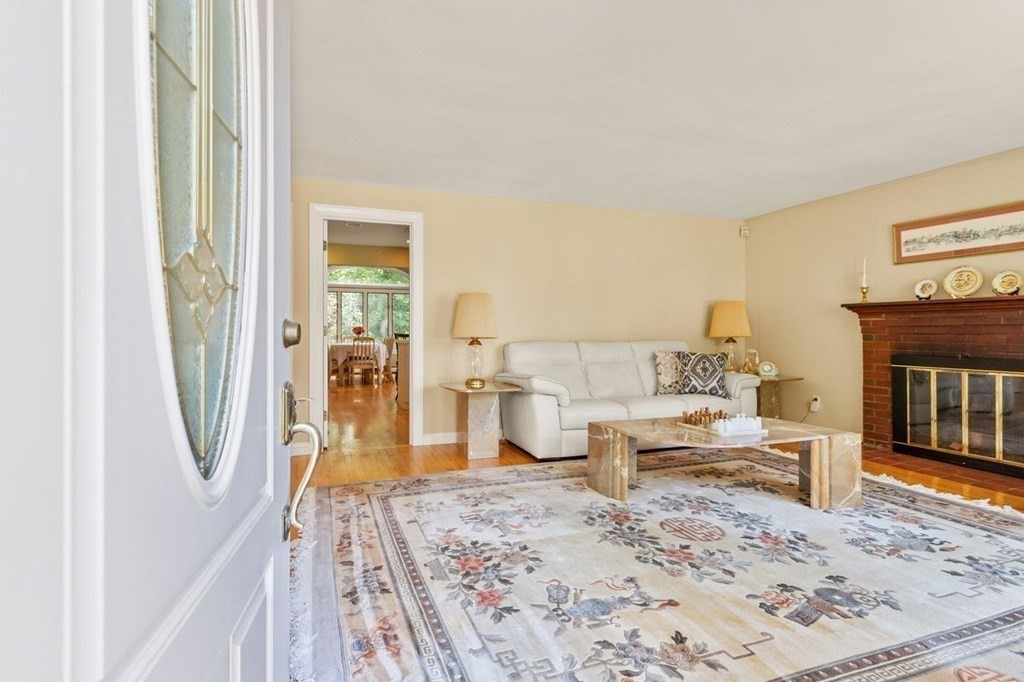 29 Marshall Road Easton, MA 02356 - Photo 3 of 31 a living room with furniture and a fireplace