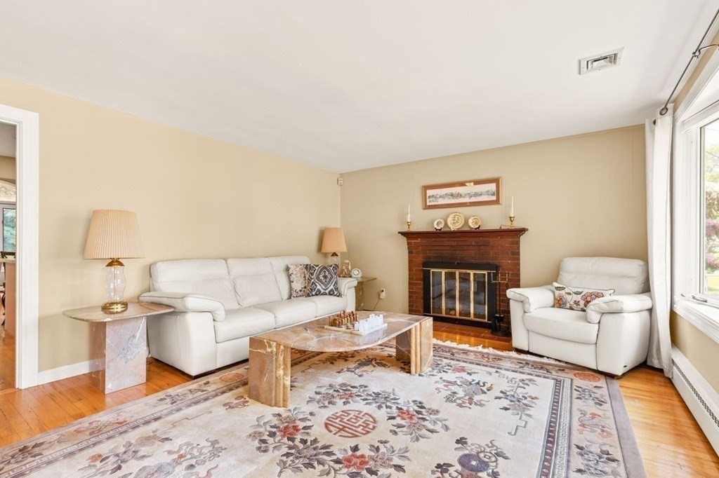 29 Marshall Road Easton, MA 02356 - Photo 4 of 31 a living room with furniture and a fireplace