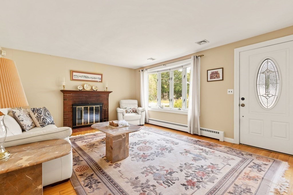 29 Marshall Road Easton, MA 02356 - Photo 5 of 31 a living room with furniture and a fireplace