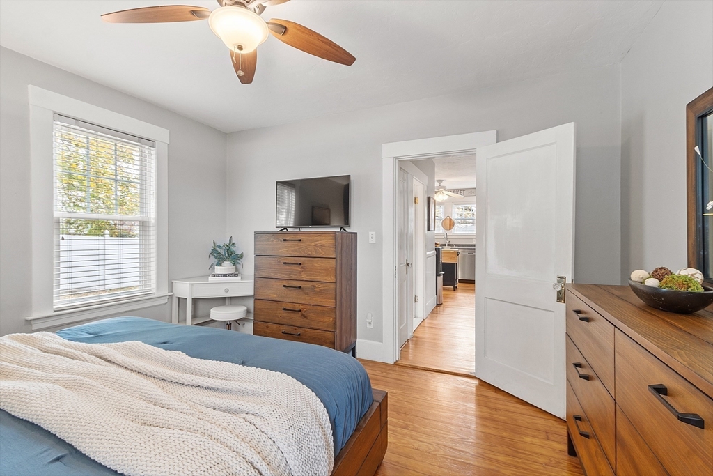 33 Herrick Road North Andover, MA 01845 - Photo 12 of 38 a bedroom with a bed and a flat screen tv