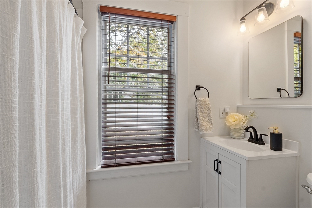 33 Herrick Road North Andover, MA 01845 - Photo 13 of 38 a bathroom with a sink and a mirror