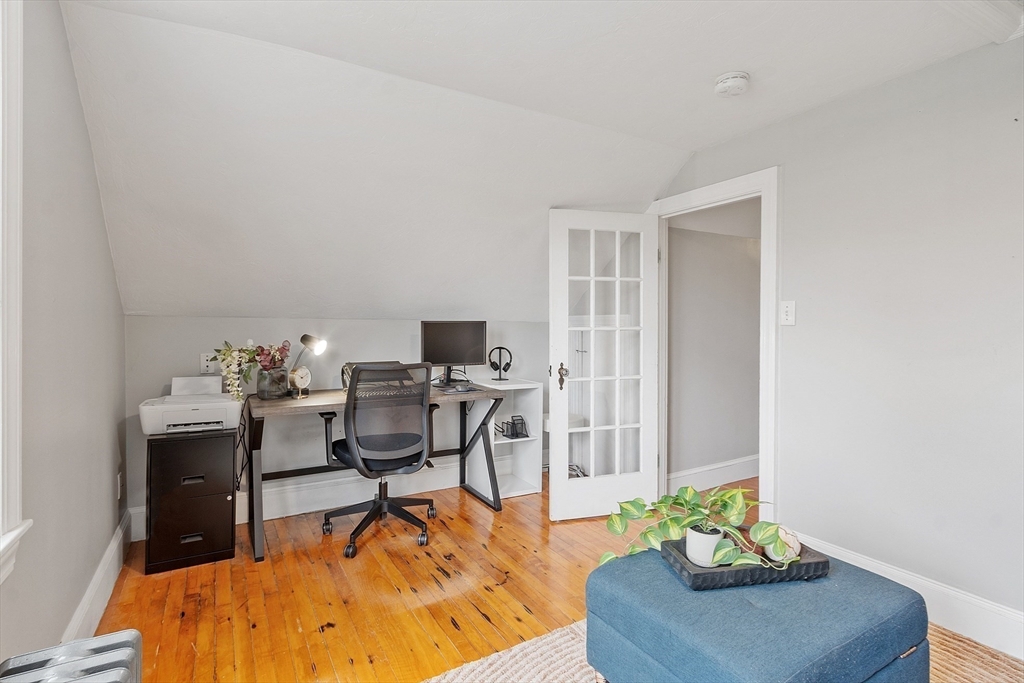 33 Herrick Road North Andover, MA 01845 - Photo 17 of 38 a living room with furniture and a flat screen tv