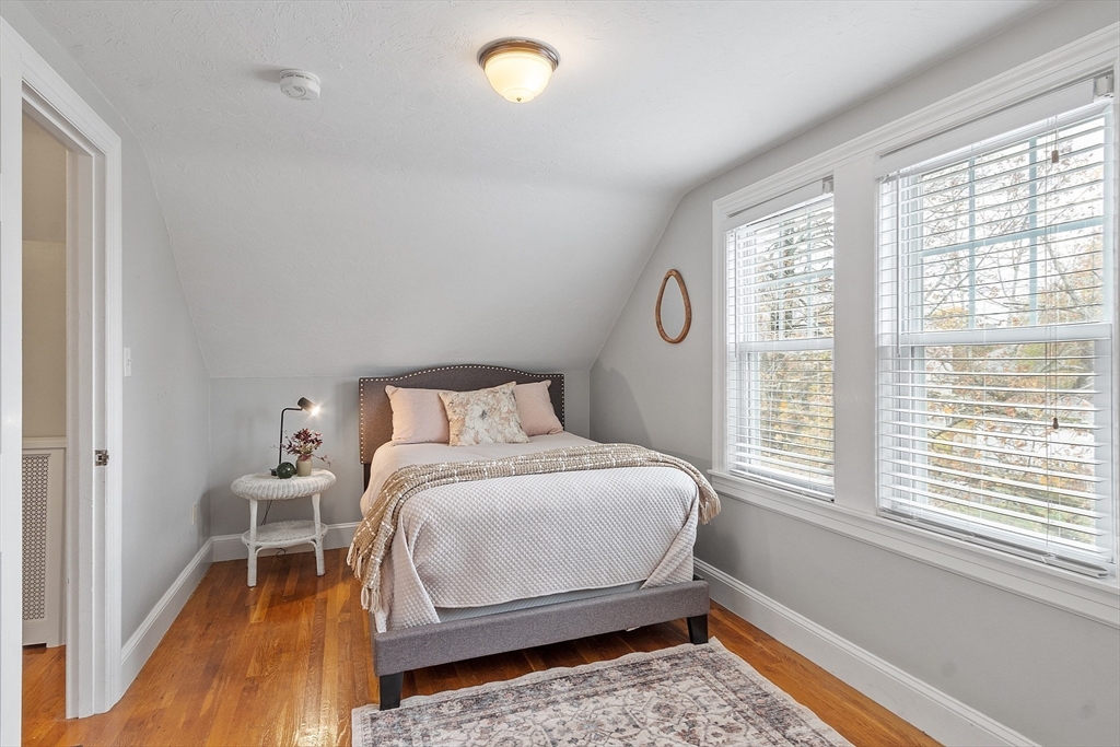 33 Herrick Road North Andover, MA 01845 - Photo 18 of 38 a bedroom with a bed and wooden floor
