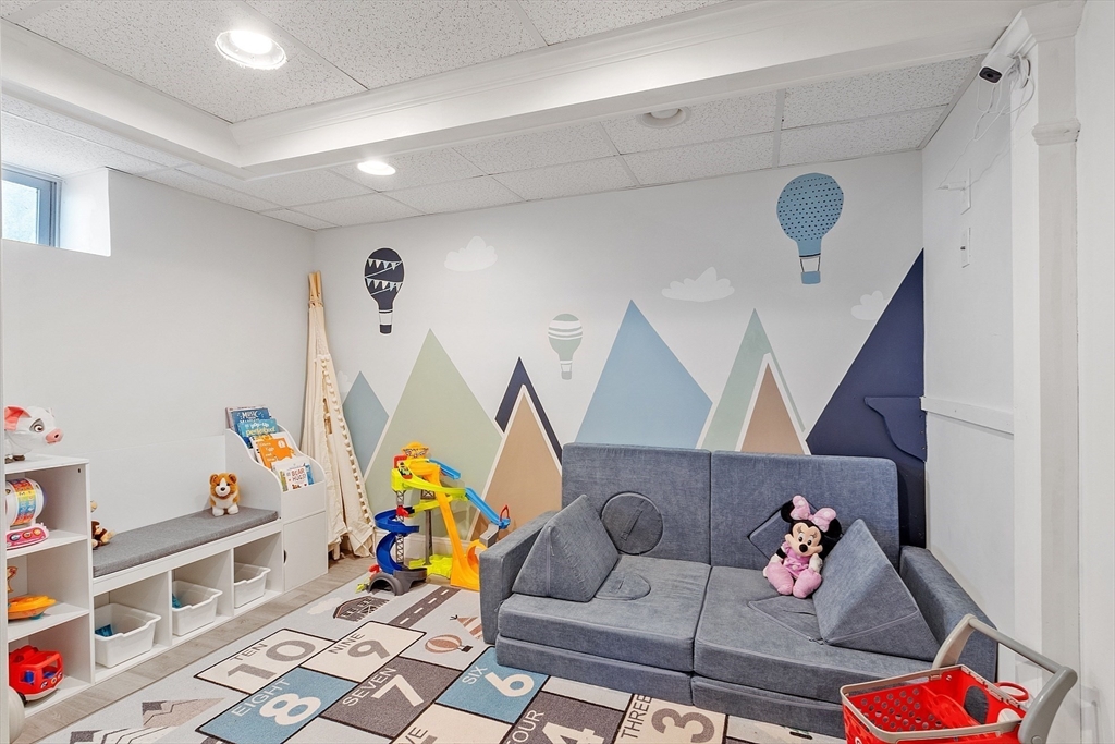 33 Herrick Road North Andover, MA 01845 - Photo 24 of 38 a living room with furniture and a couch