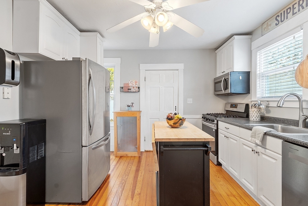33 Herrick Road North Andover, MA 01845 - Photo 7 of 38 a kitchen that has a refrigerator a sink and a stove
