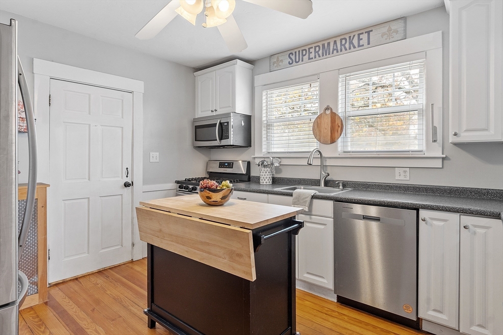 33 Herrick Road North Andover, MA 01845 - Photo 8 of 38 a kitchen with sink cabinets and window