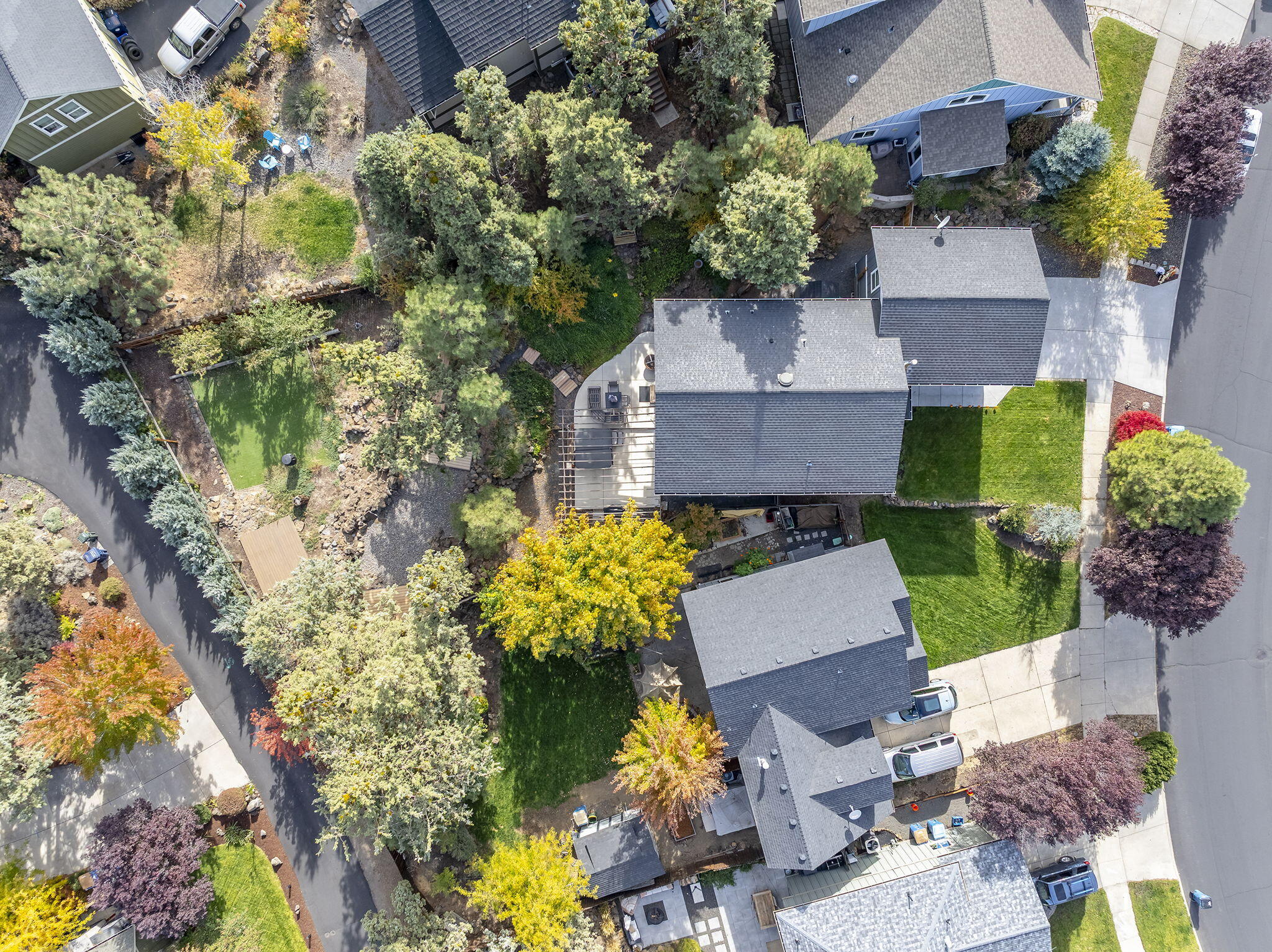 62906 Bilyeu Way Bend, OR 97701 - Photo 57 of 100 an aerial view of a house with a yard and a large tree