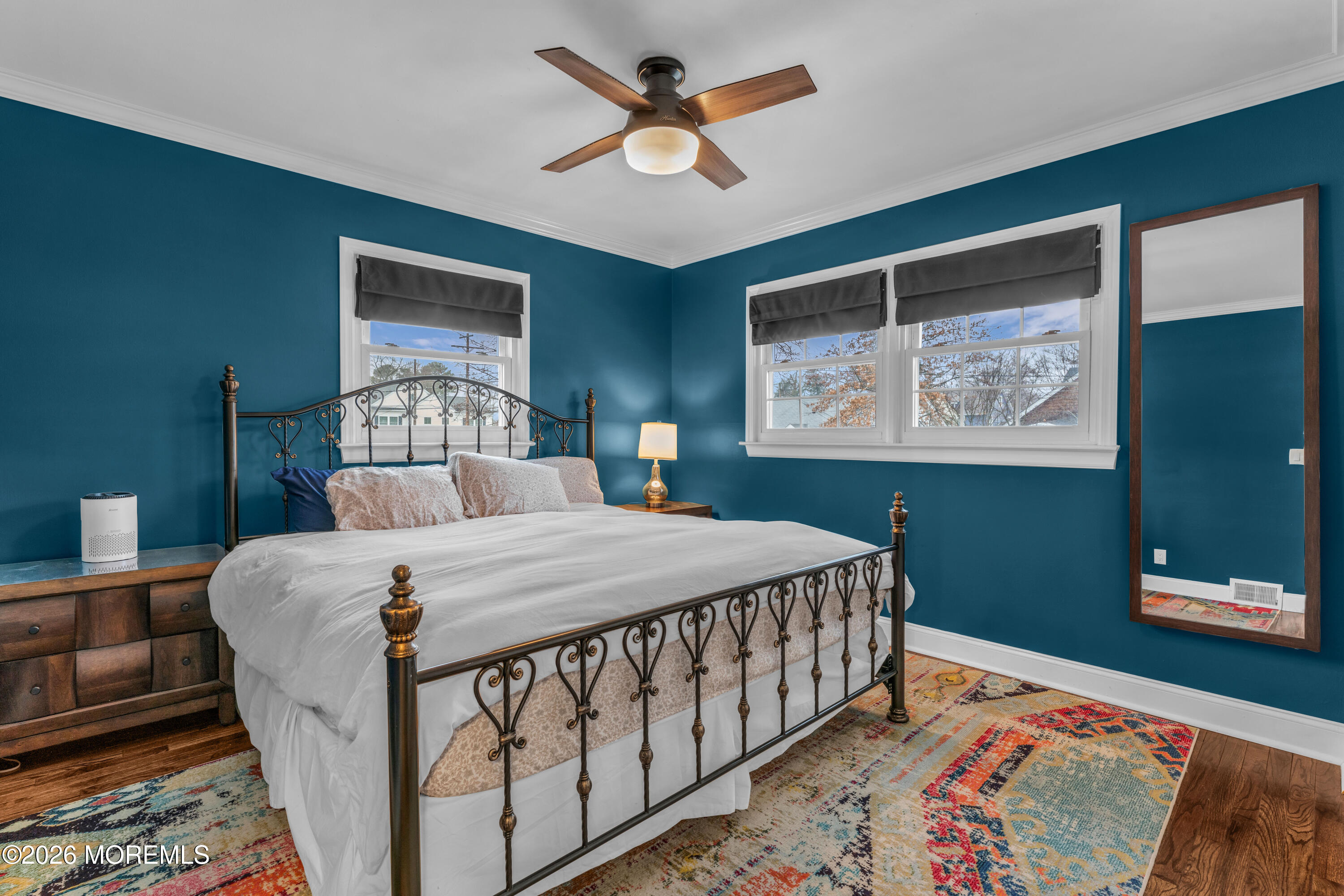 75 Carpenter Street Red Bank, NJ 07701 - Photo 11 of 28 a bedroom with a bed a dresser and painting on the wall