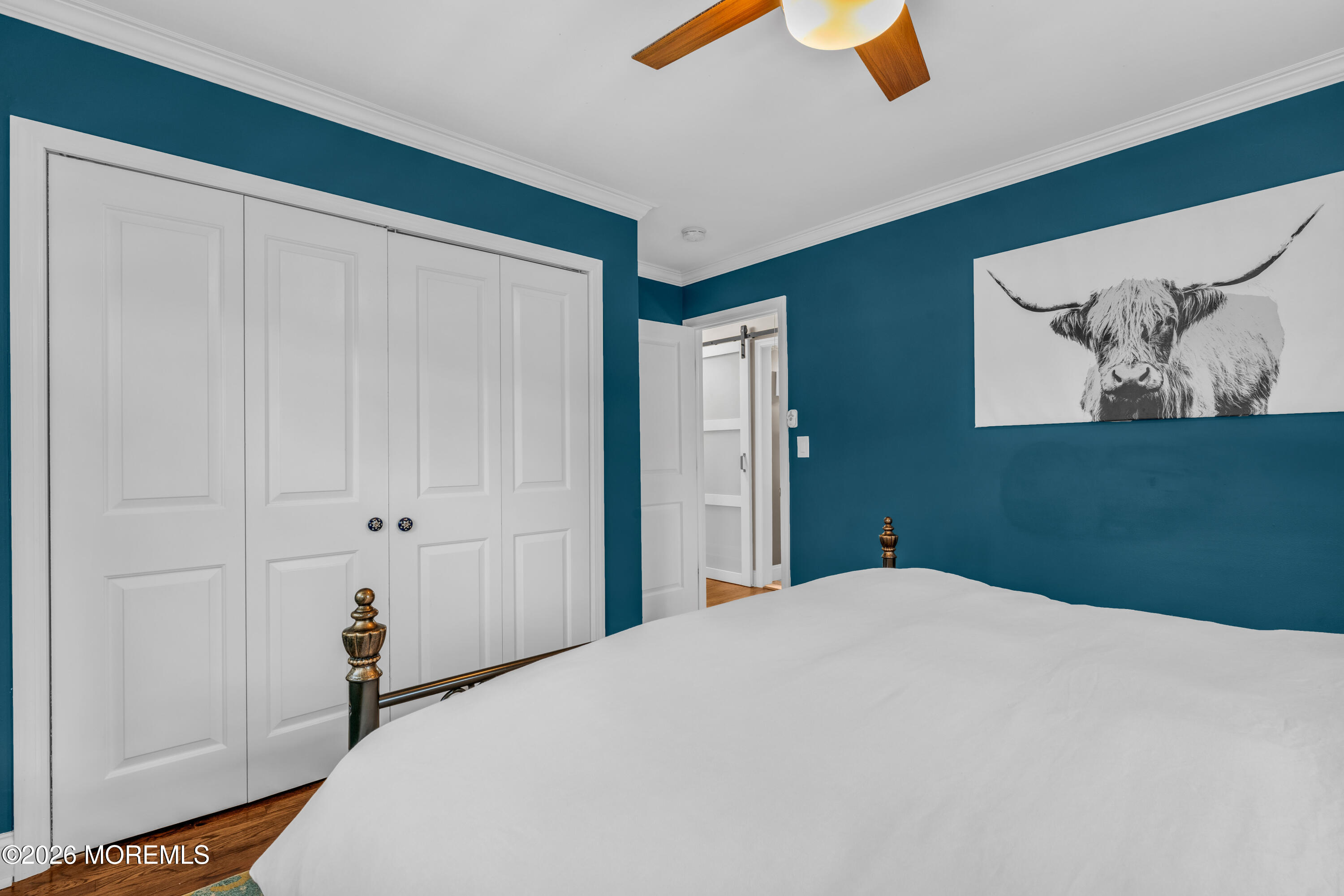 75 Carpenter Street Red Bank, NJ 07701 - Photo 12 of 28 a bedroom with a bed and a painting on the wall