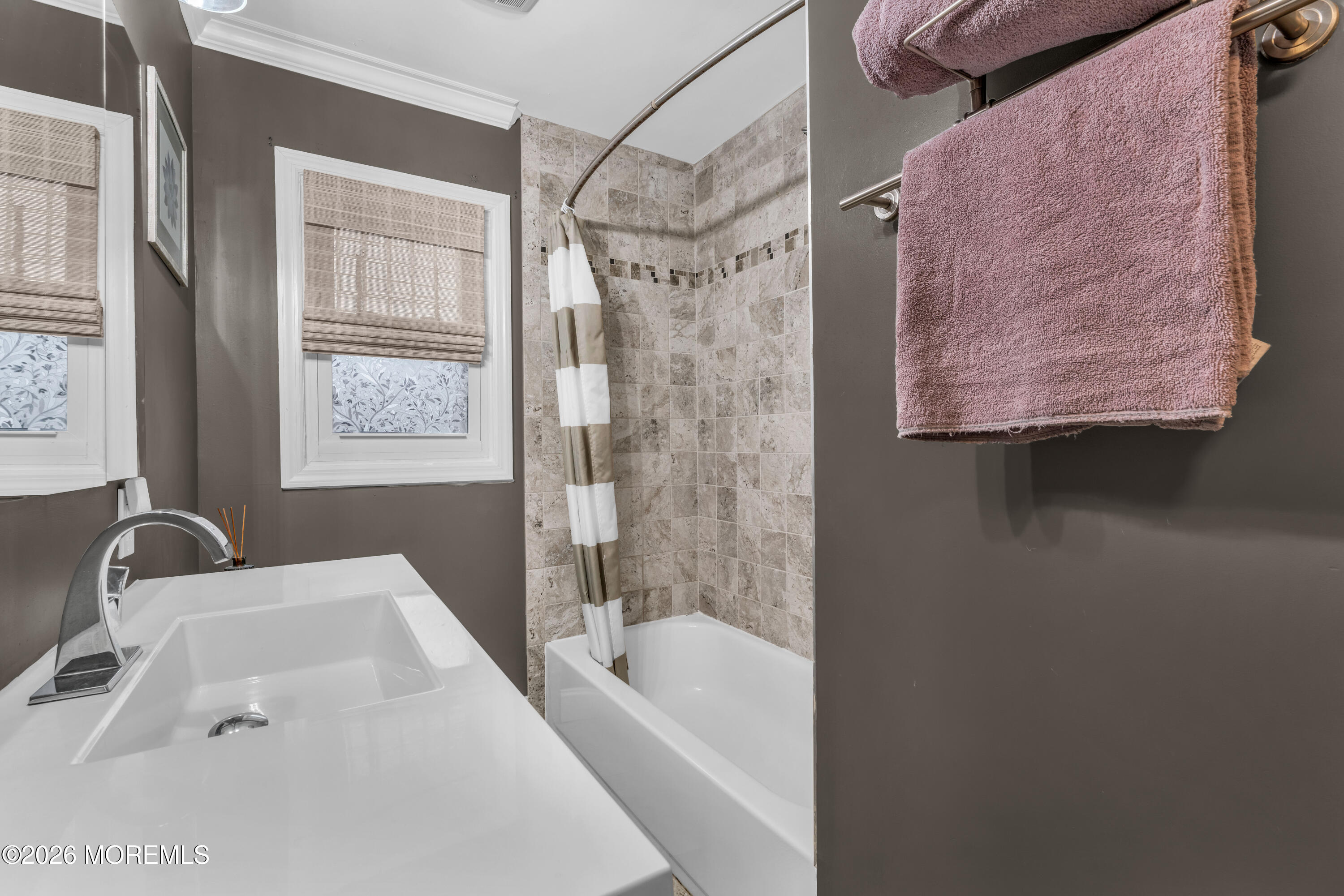 75 Carpenter Street Red Bank, NJ 07701 - Photo 16 of 28 a bathroom with a tub sink and shower