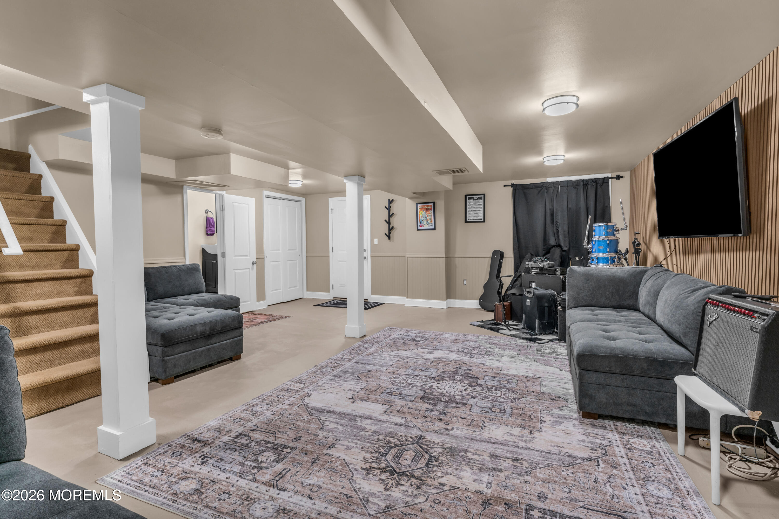 75 Carpenter Street Red Bank, NJ 07701 - Photo 20 of 28 a living room with furniture and a flat screen tv