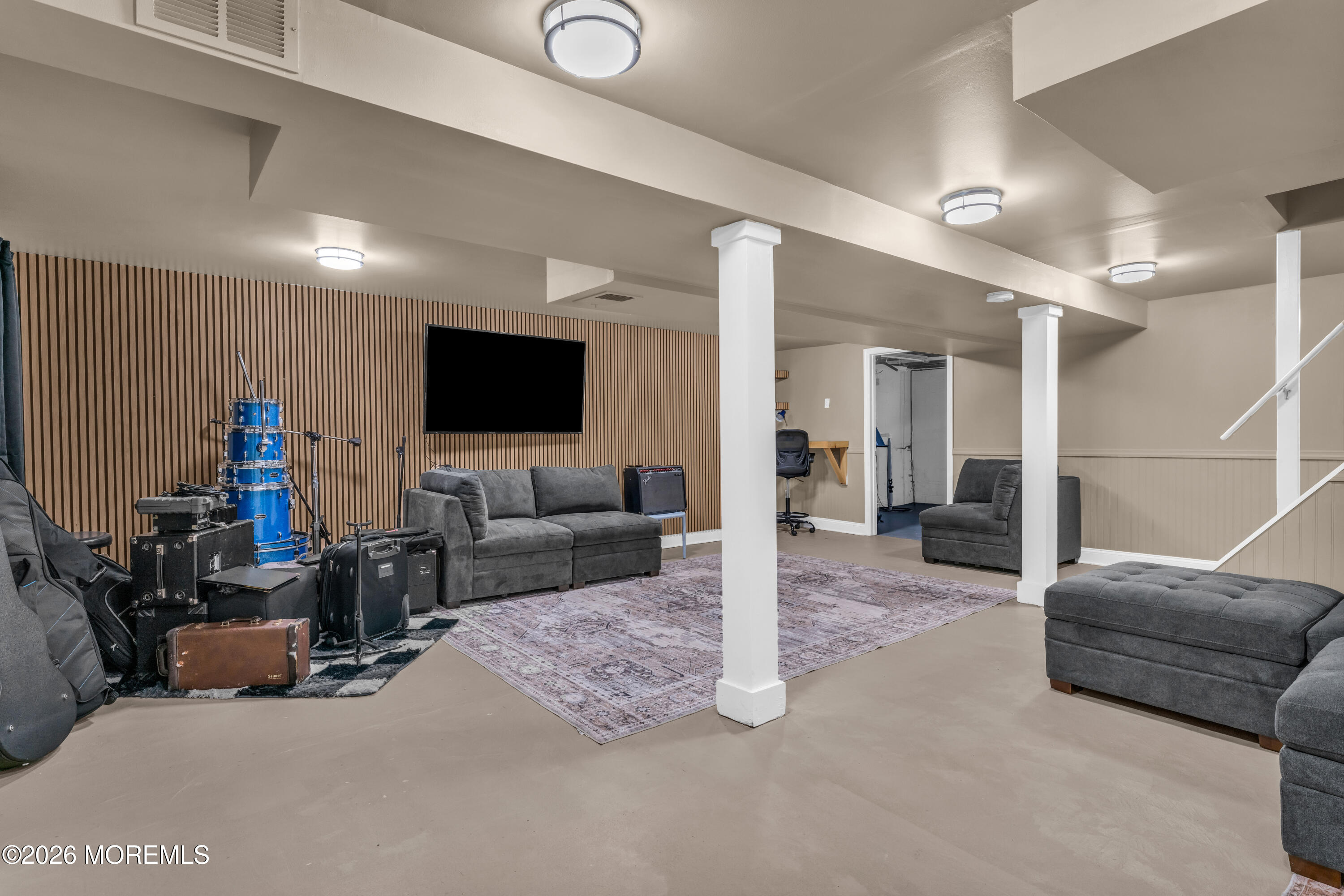 75 Carpenter Street Red Bank, NJ 07701 - Photo 21 of 28 a living room with furniture and a flat screen tv