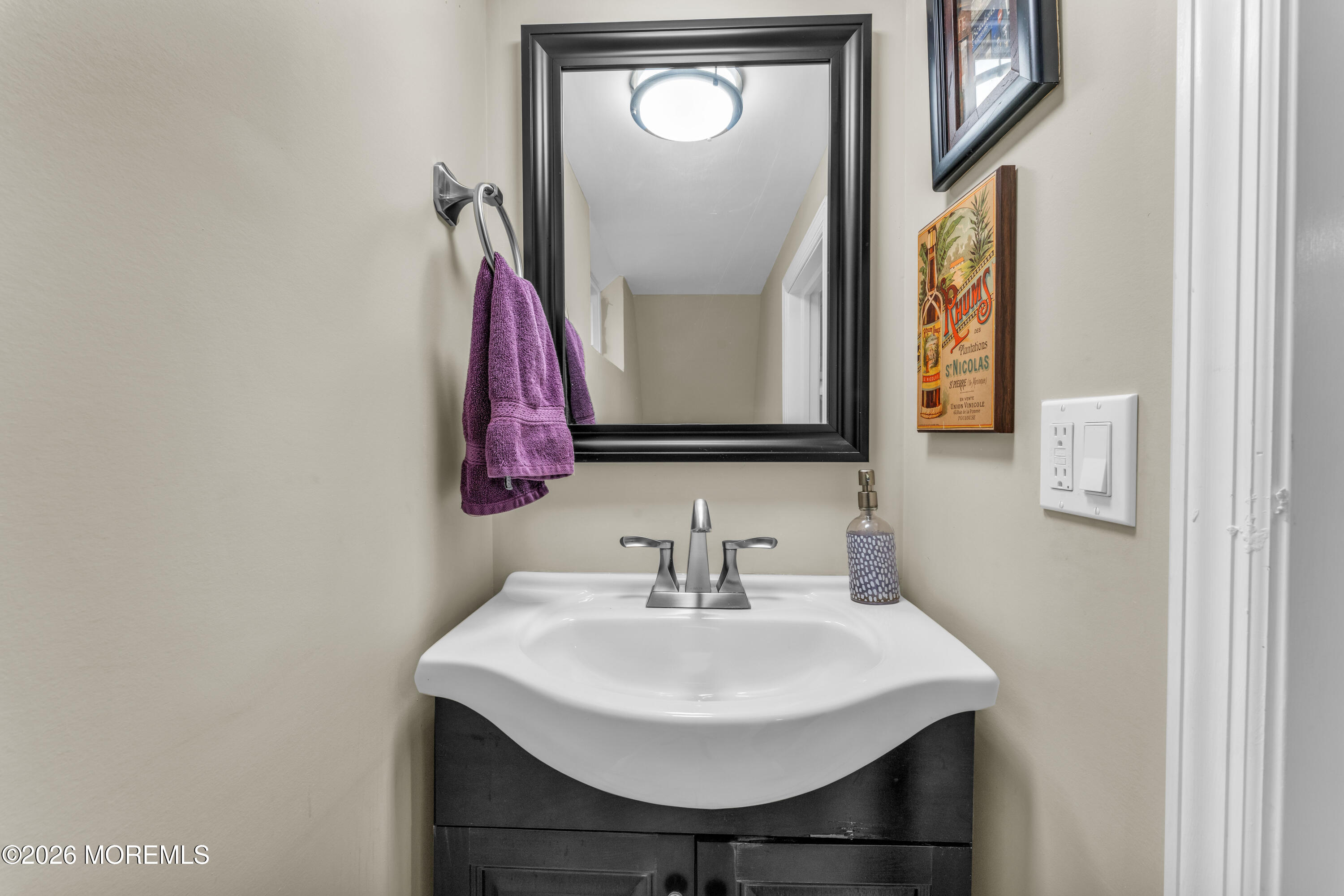 75 Carpenter Street Red Bank, NJ 07701 - Photo 22 of 28 a bathroom with a sink a mirror and a toilet