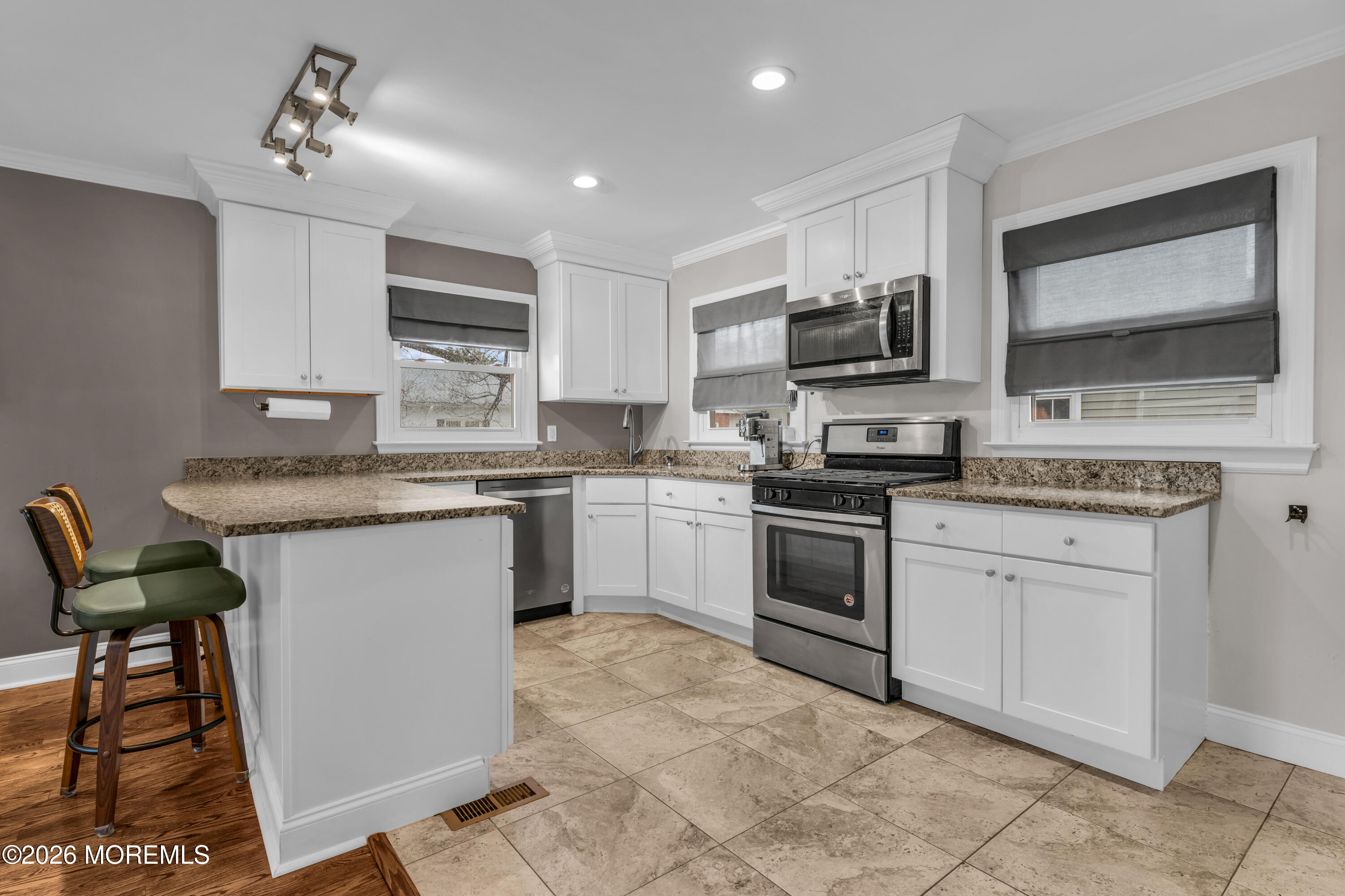 75 Carpenter Street Red Bank, NJ 07701 - Photo 7 of 28 a kitchen with a stove a sink and a microwave