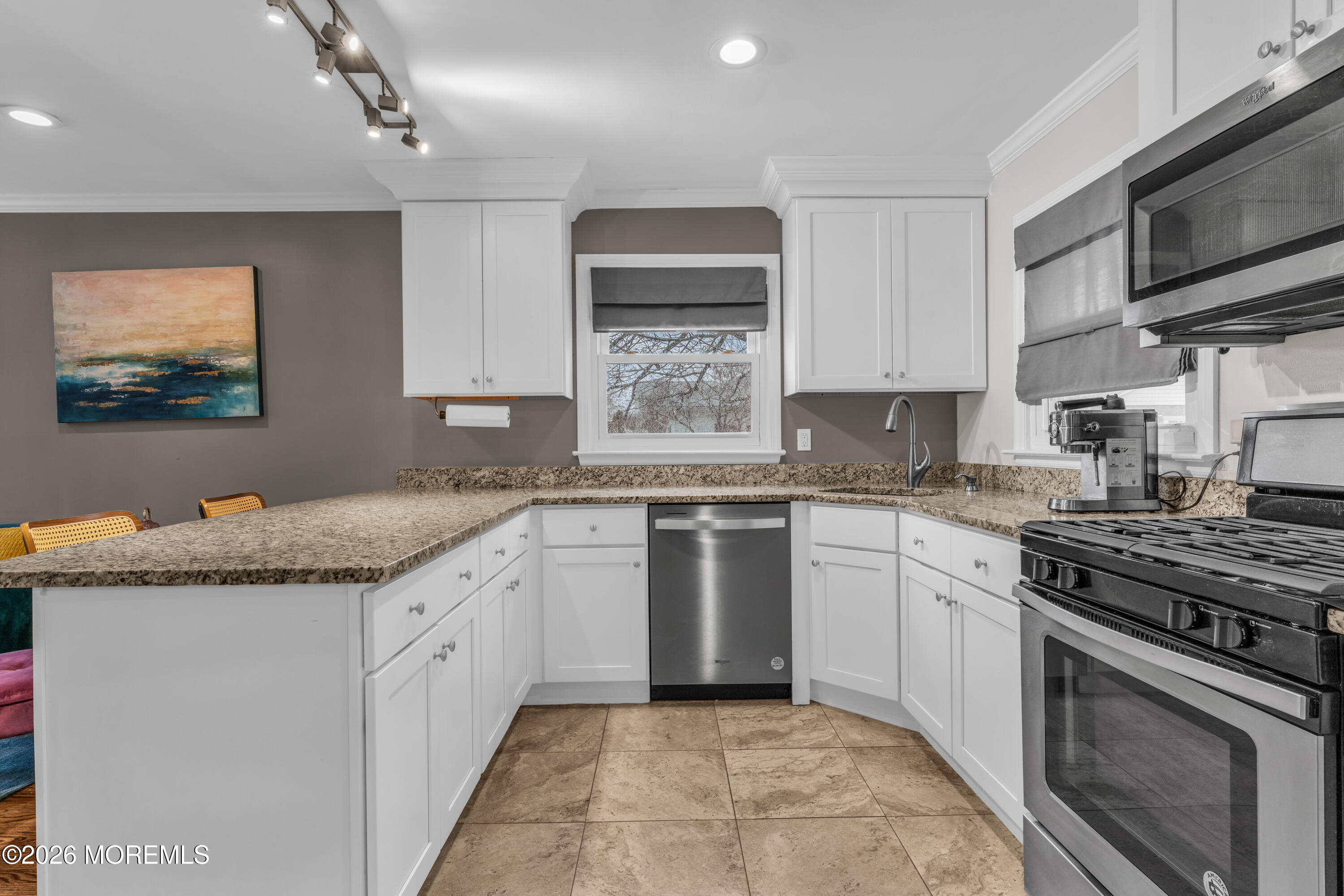 75 Carpenter Street Red Bank, NJ 07701 - Photo 8 of 28 a kitchen with granite countertop a sink stainless steel appliances and cabinets