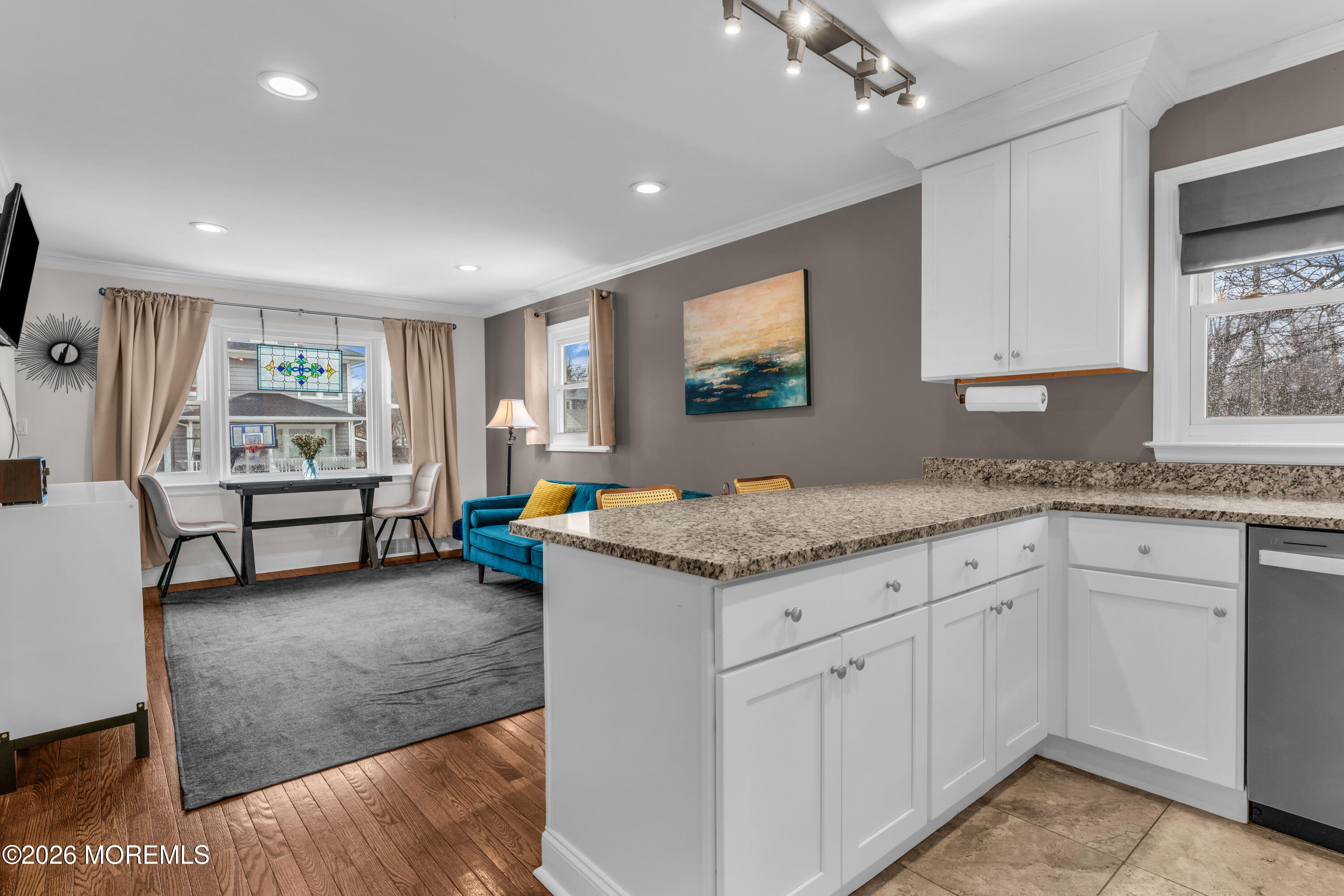 75 Carpenter Street Red Bank, NJ 07701 - Photo 9 of 28 a living room with granite countertop furniture and a flat screen tv