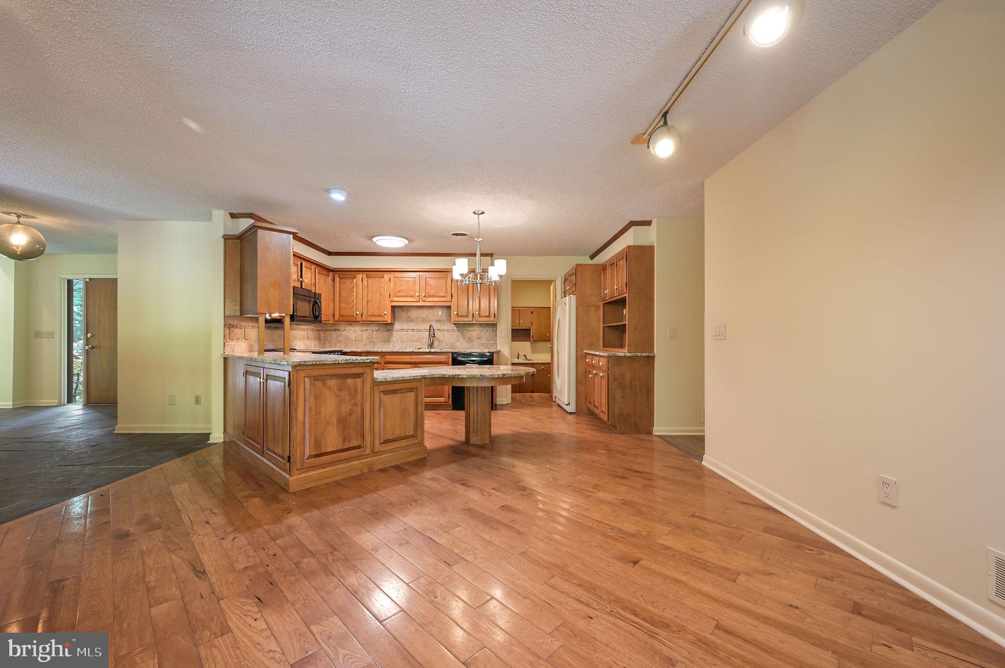 124 Meadowglen Drive Dover, DE 19901 - Photo 12 of 27 a large kitchen with stainless steel appliances granite countertop a refrigerator and a stove top oven