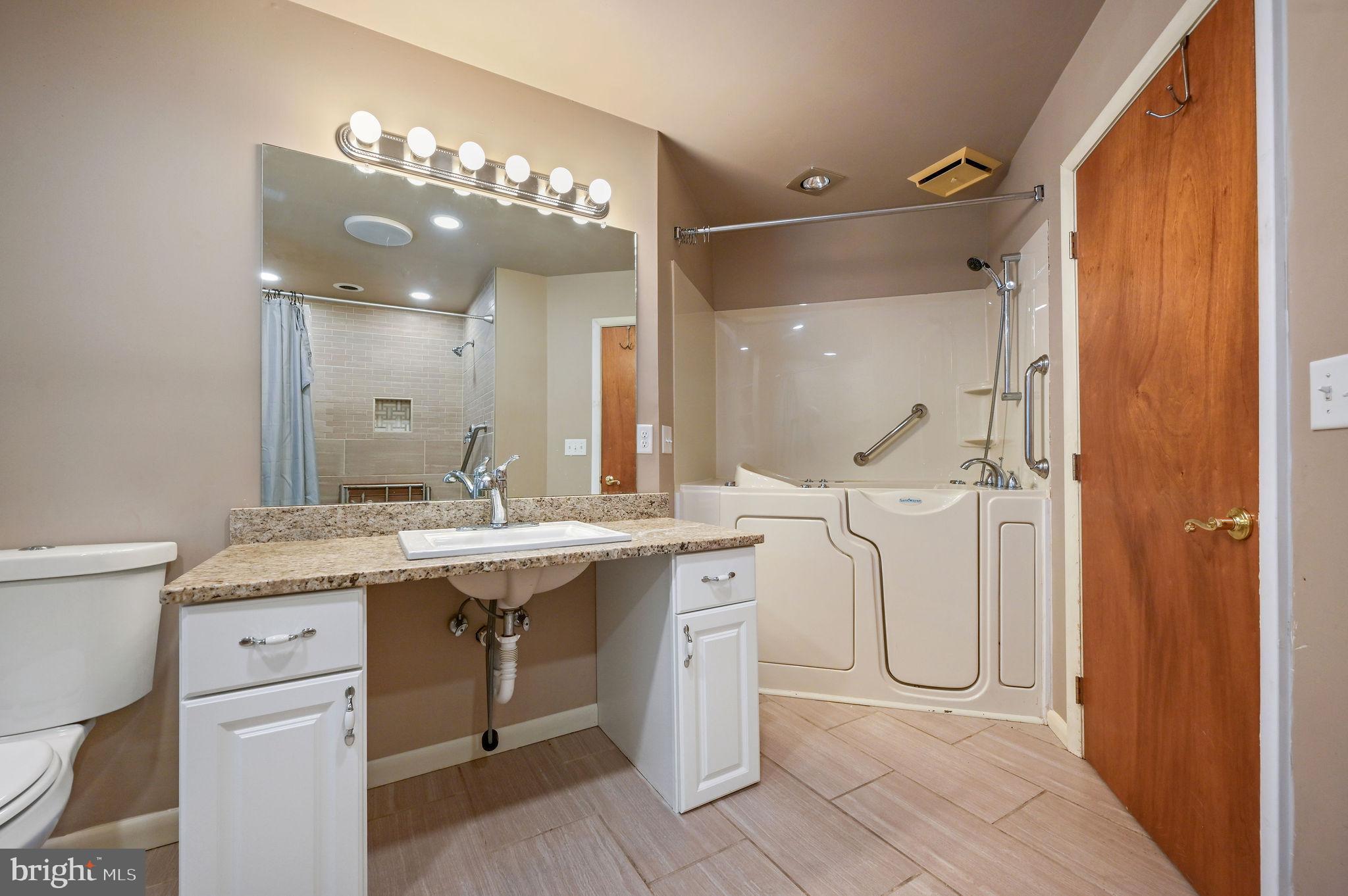 124 Meadowglen Drive Dover, DE 19901 - Photo 18 of 27 a bathroom with a double vanity sink mirror and toilet