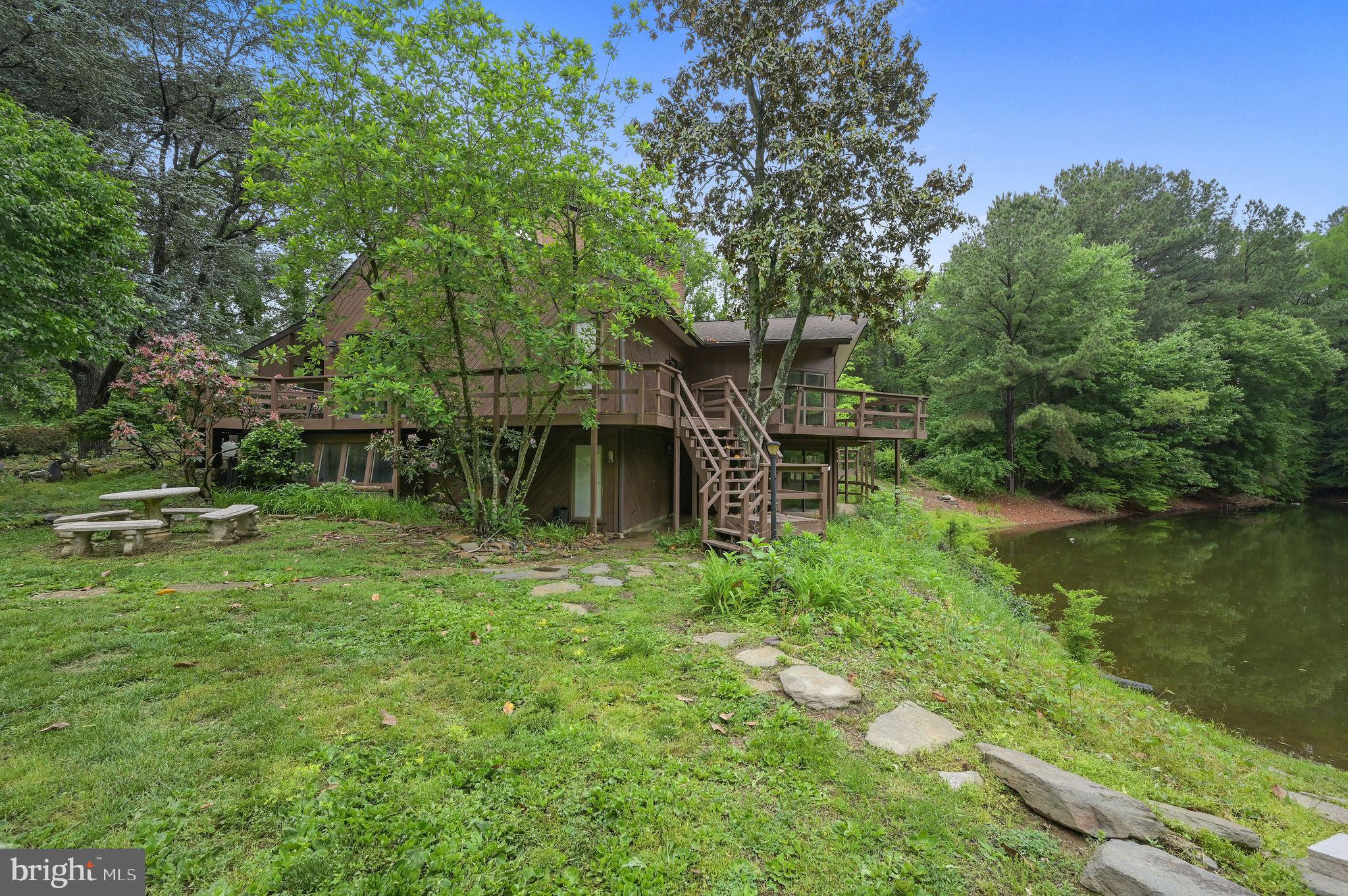 124 Meadowglen Drive Dover, DE 19901 - Photo 2 of 27 a backyard of a house with lots of green space