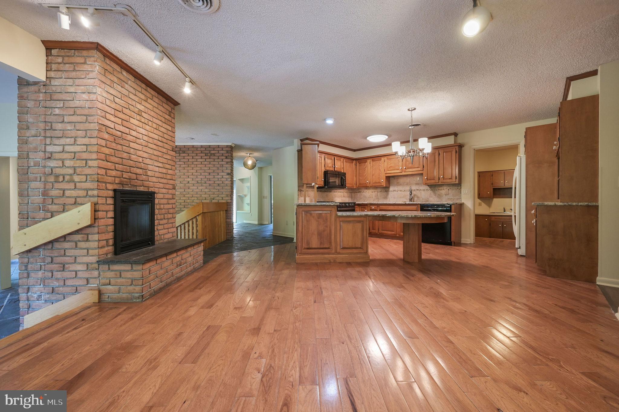 124 Meadowglen Drive Dover, DE 19901 - Photo 23 of 27 a large kitchen with stainless steel appliances granite countertop a stove and a refrigerator