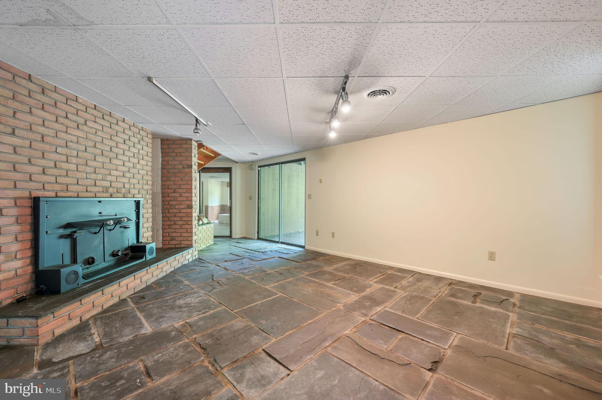 124 Meadowglen Drive Dover, DE 19901 - Photo 27 of 27 a view of an empty room with a fireplace