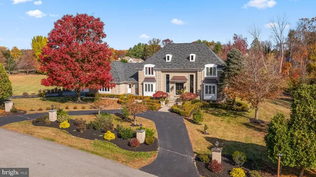 aerial view of a house with a yard