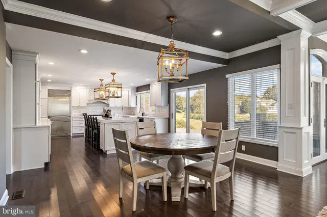 a kitchen with granite countertop a sink a stove a refrigerator and a stove