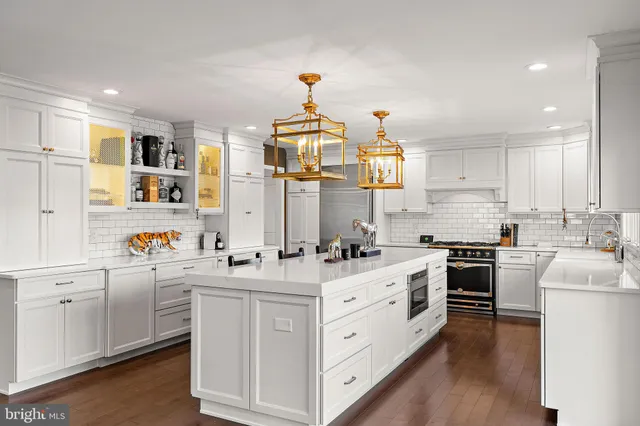 a stove top oven sitting inside of a kitchen