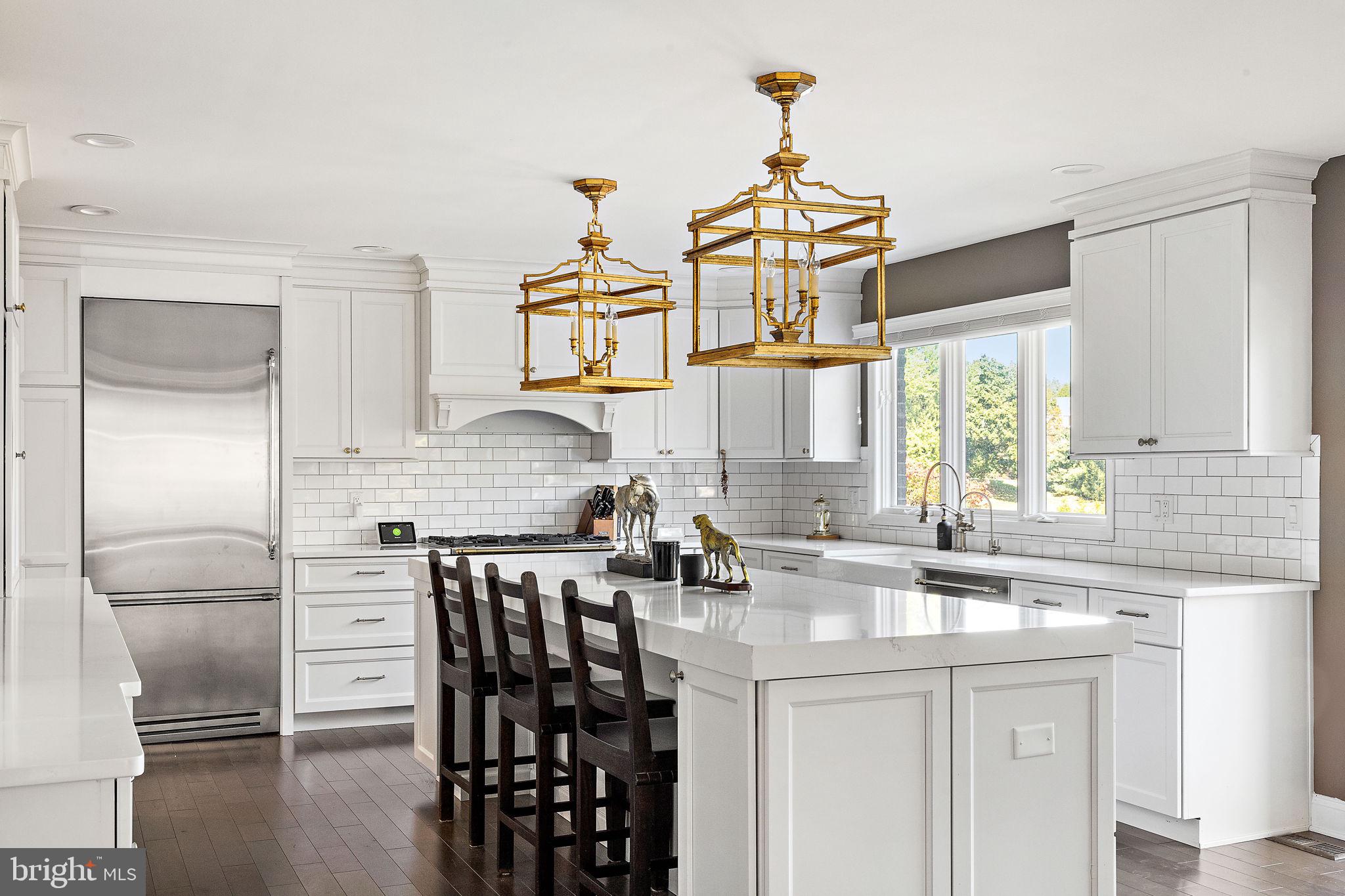 200 Dogwood Slope Road Wilmington, DE 19807 - Photo 19 of 80 a kitchen with stainless steel appliances kitchen island granite countertop a sink and cabinets