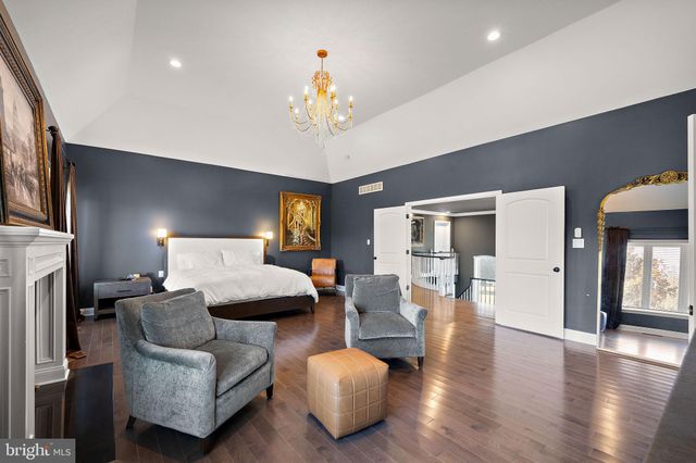 a large room with a bed and a night stand