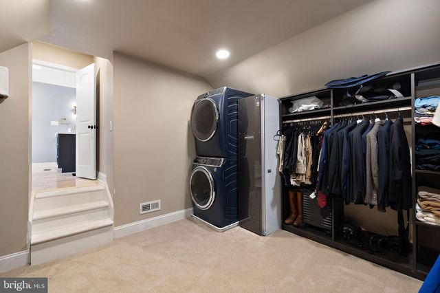 a swimming pool with outdoor seating and yard