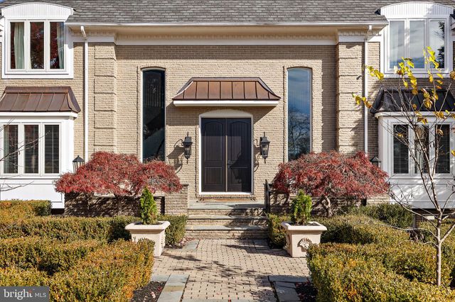 a view of staircase with lots of frames and a wooden floor