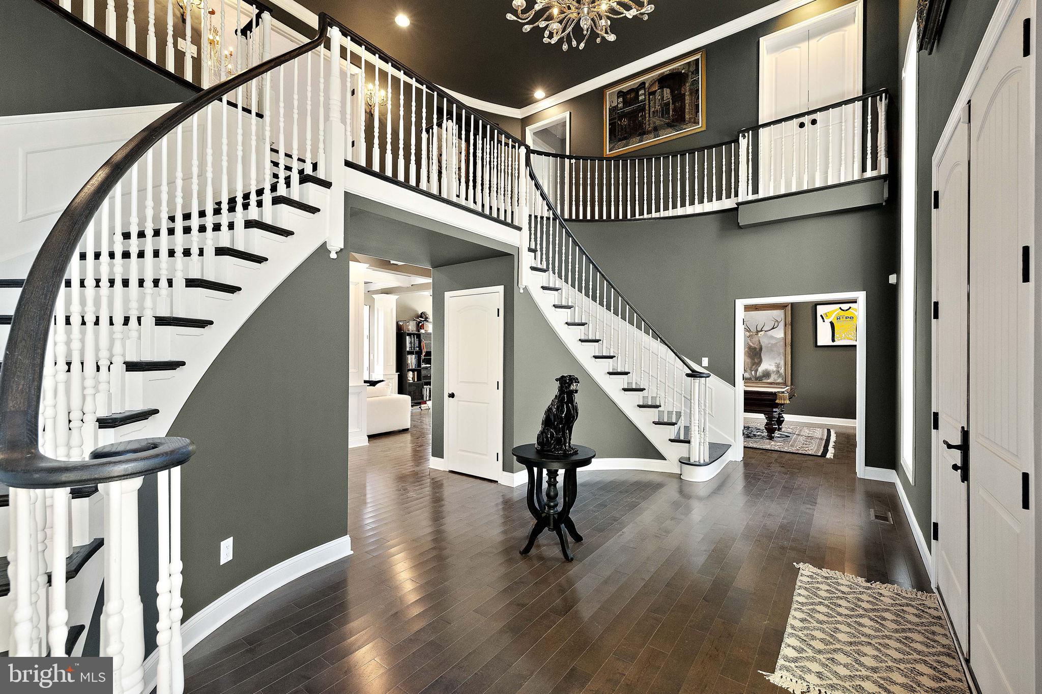 200 Dogwood Slope Road Wilmington, DE 19807 - Photo 7 of 80 a view of staircase with lots of frames and a wooden floor