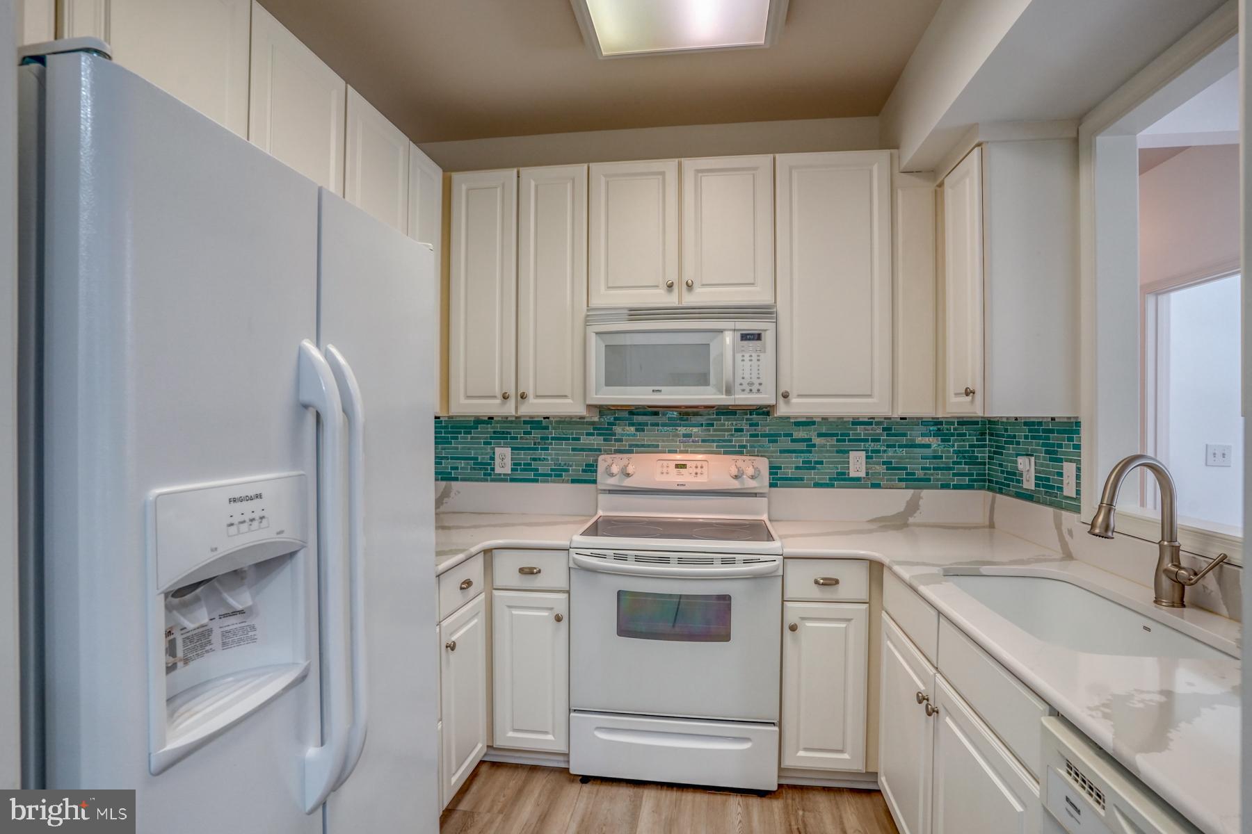 30619 Cedar Neck Road, Unit 1103 Ocean View, DE 19970 - Photo 34 of 58 Upgraded kitchen with quartz counters