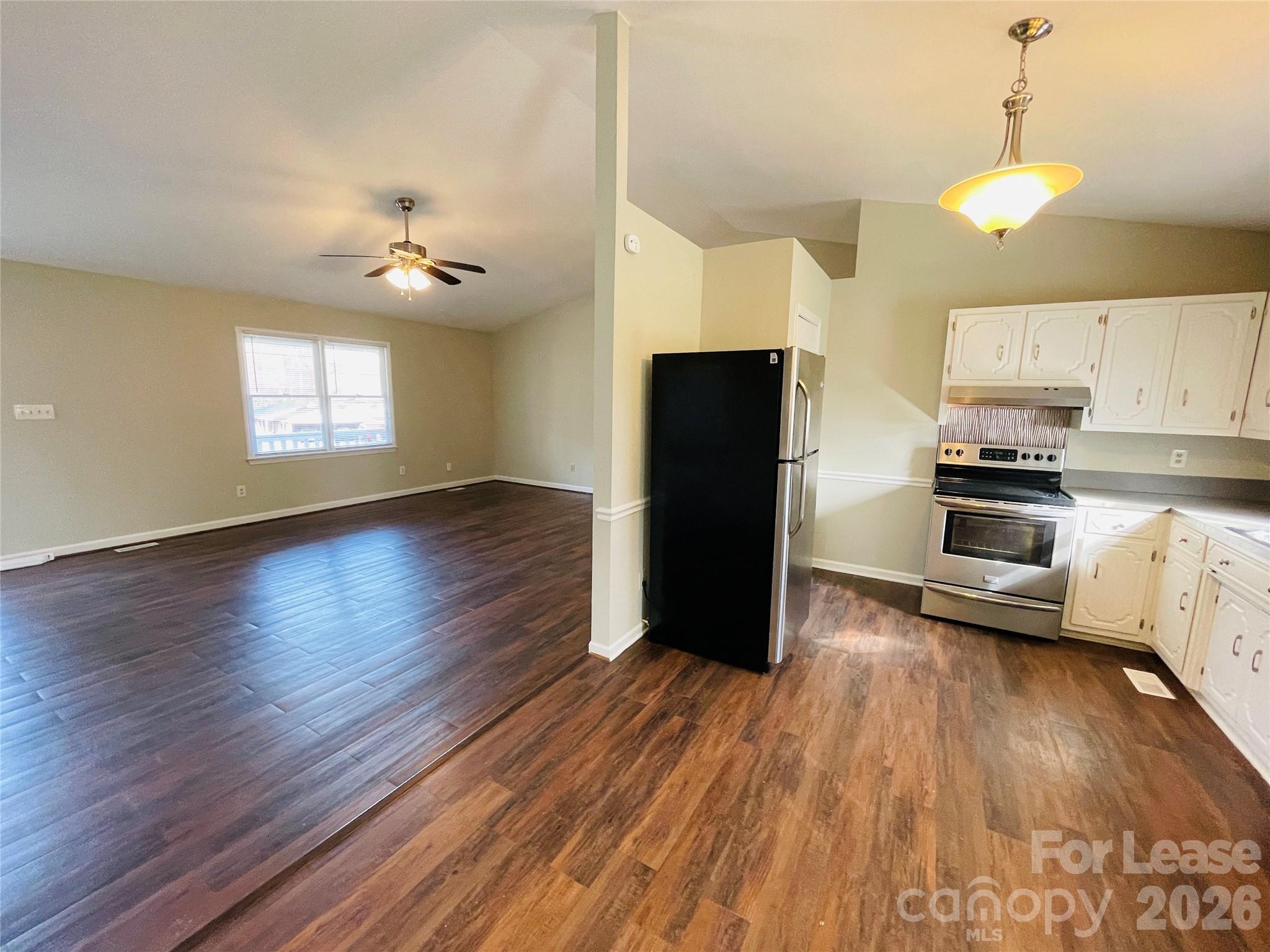 2499 Brookwood Road Lincolnton, NC 28092 - Photo 3 of 12 a view of kitchen with stainless steel appliances wooden floor and window