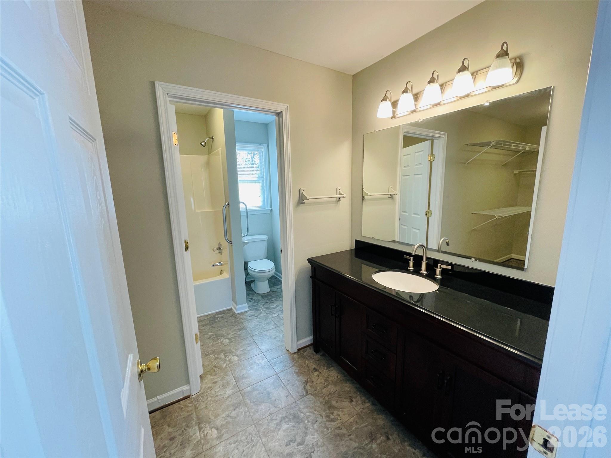 2499 Brookwood Road Lincolnton, NC 28092 - Photo 9 of 12 a bathroom with a sink and a mirror