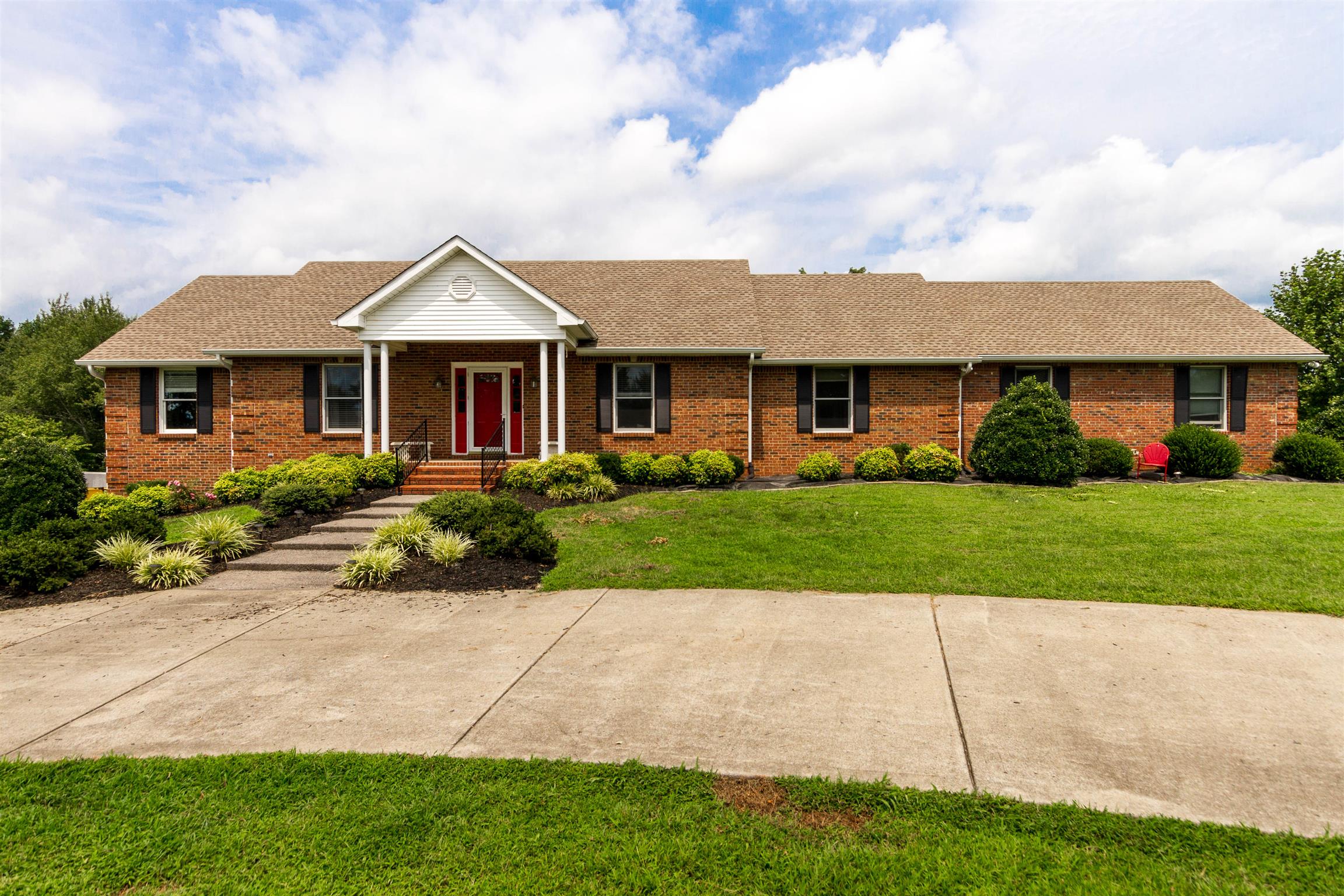 1941 Bradbury Road Adams, TN 37010 - Photo 1 of 30 a front view of a house with a yard