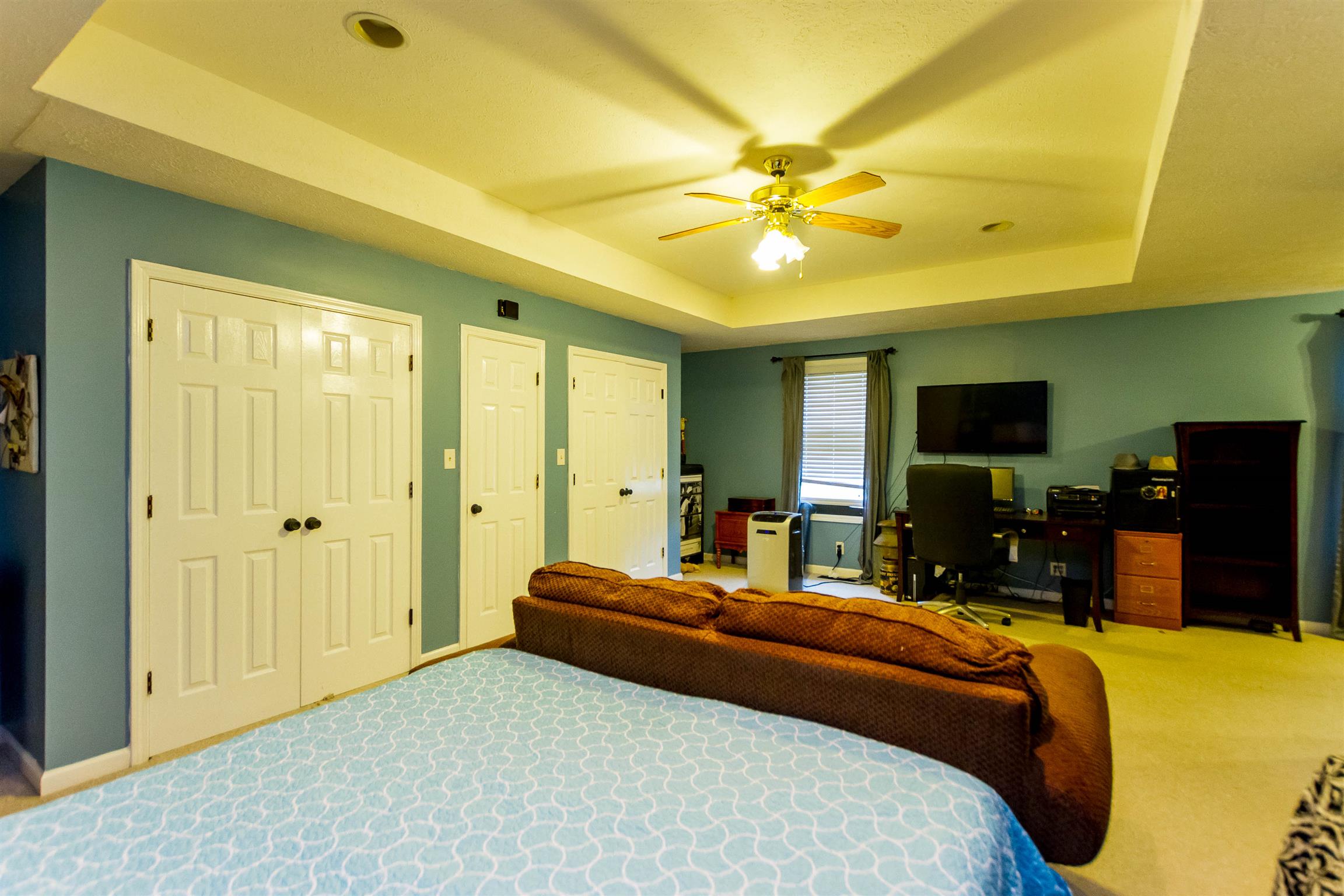 1941 Bradbury Road Adams, TN 37010 - Photo 16 of 30 a bedroom with a bed and a flat tv screen on dresser